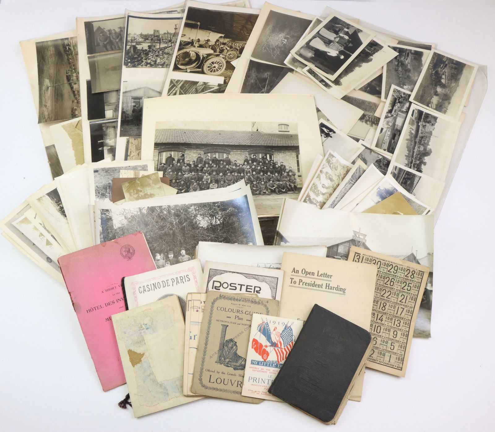 World War I Photographs and Ephemera: World War I photographic and document archive including; 1.) Grouping of 139 photographs (2” x 1.5” up to 11” x 14”) showing camp scenes, vehicles aerial views, bombed/shelled