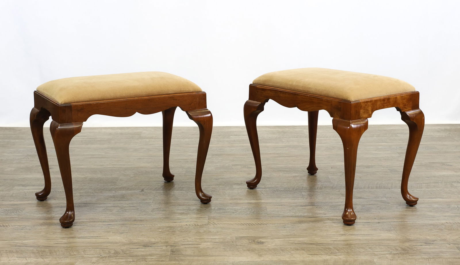 L. & J.G. Stickley Stools: Wild cherry having suede tops on cabriole legs and pad feet. Bench No. 4170. 18.5"h x 23"w x 15"d. Pair