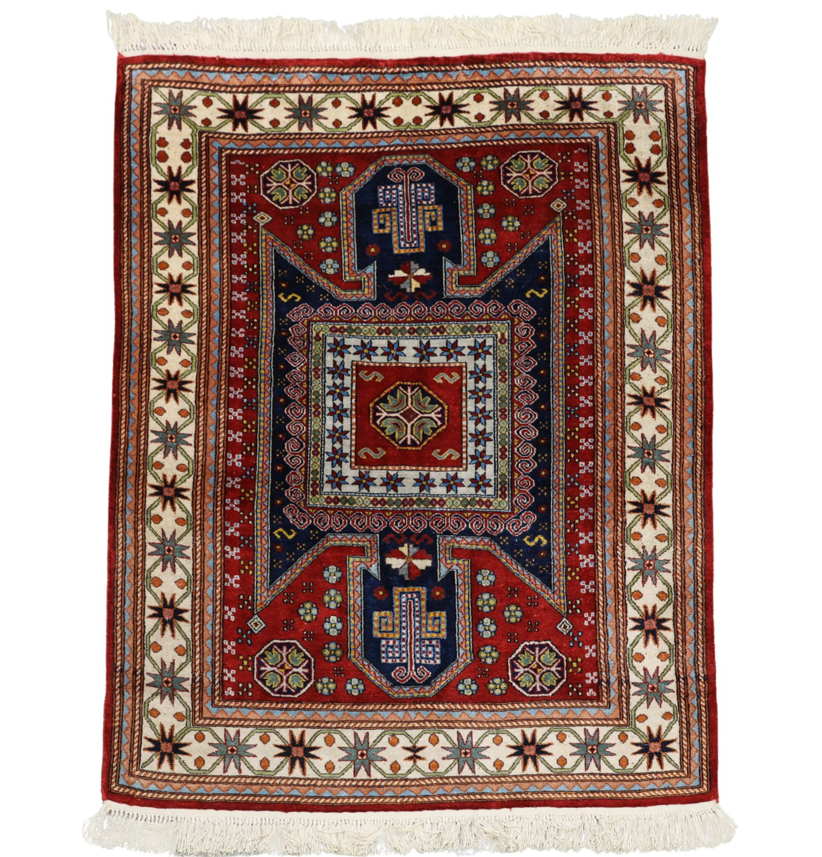 Caucasian Sewan Kazak Rug: Hand knotted having a bold double sided central medallion with repeating floral and geoemtric motifs throughout the field with repeating crab motifs in the main border. Multi-colors of mainly red,