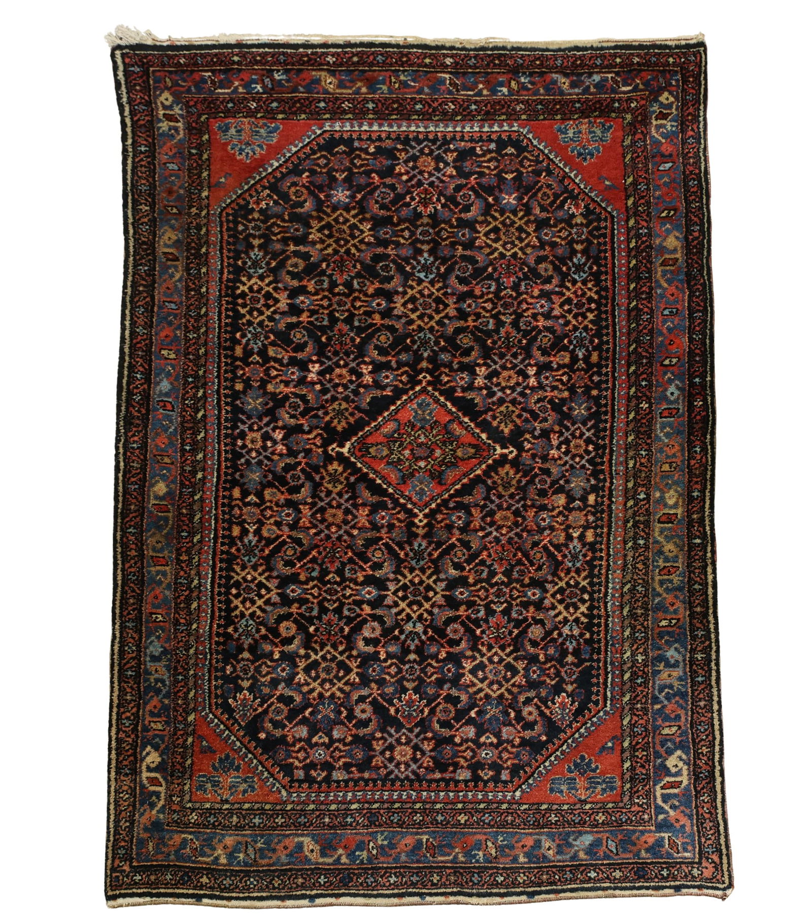 Persian Hamadan Rug: Hand knotted wool pile with a central herati diamond medallion surrounded by a herati diamond patttern in the field with meanderinhg fish boteh in the main border. Colors mainly in dark and light
