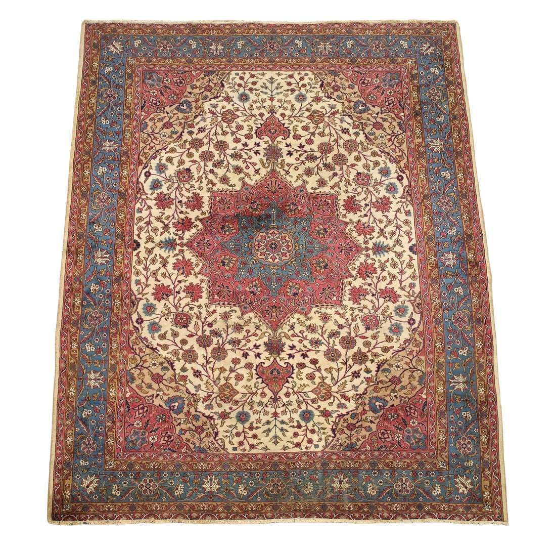 Northwest Persian Carpet: Hand knotted having a central cloud collar medallion with pendants, surrounding stylized flowerhead and sprig pattern with curvilinear spandrels, repeating floral cartouches in the main border with