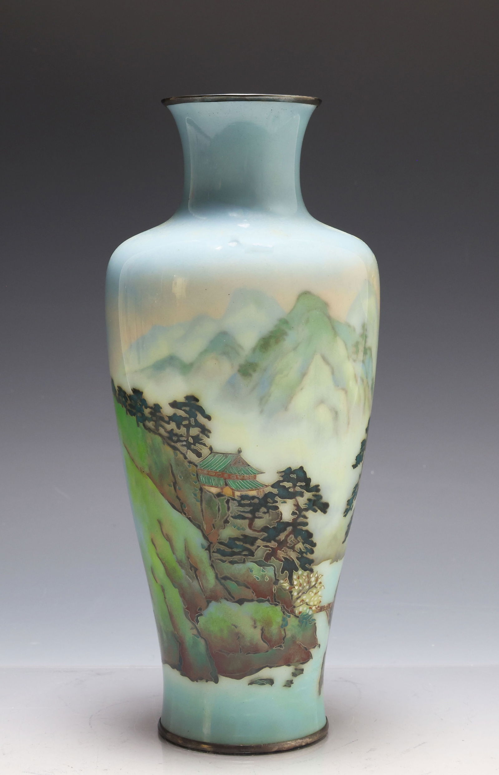 Japanese Cloisonne Vase: Meiji - Taisho era silver wire cloisonne baluster vase depicting a river in a hazy mountain landscape with a building and a bridge. Unmarked. There is an area of damage to the shoulder. 9.75"h x 4"w