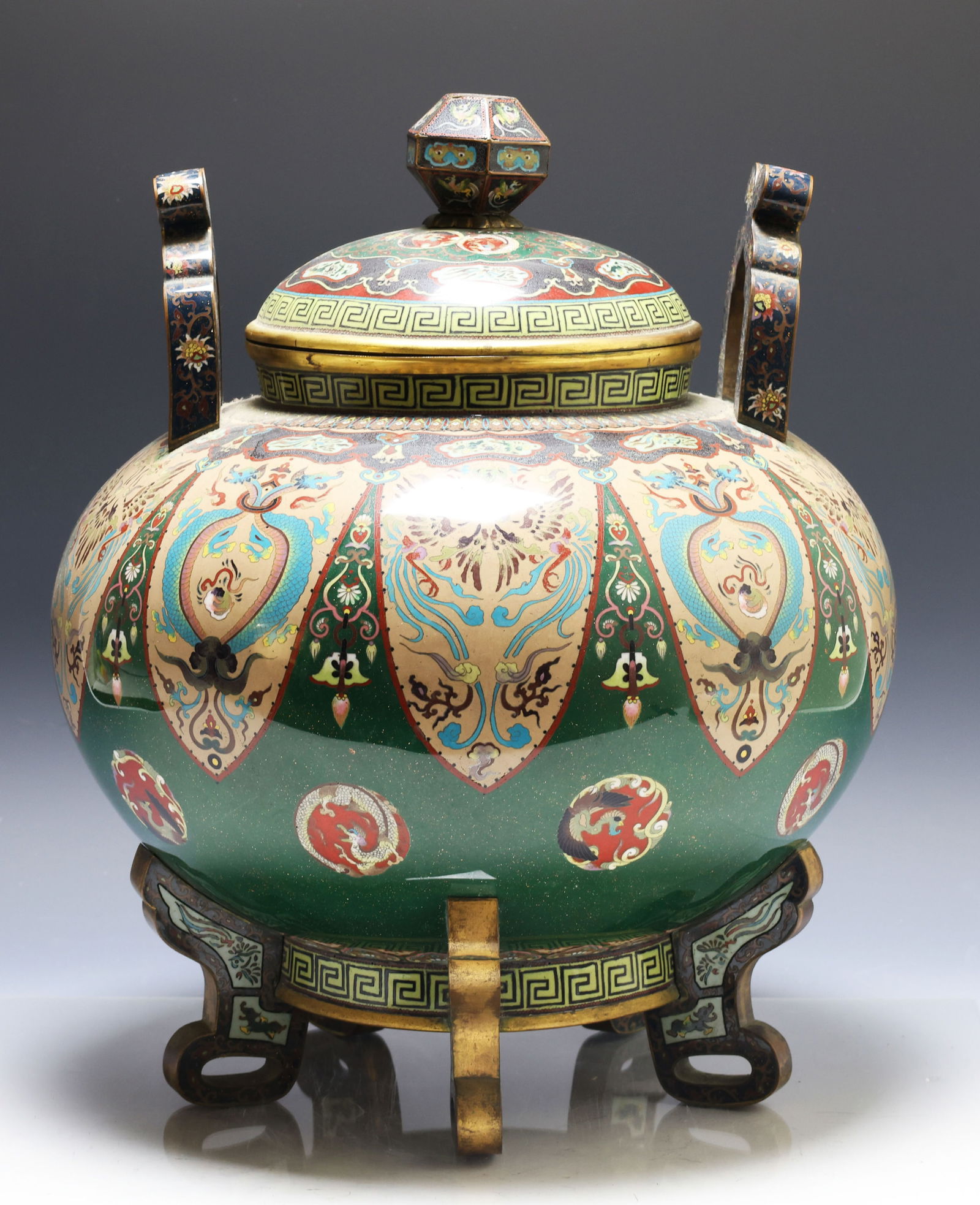 Japanese Goldstone Cloisonne Censer: Meiji - Taisho era silver wire cloisonne covered koro censer with handles, openwork bracket feet, and a faceted finial, decorated with lappets, balls, and panels featuring stylized dragons and phoenix