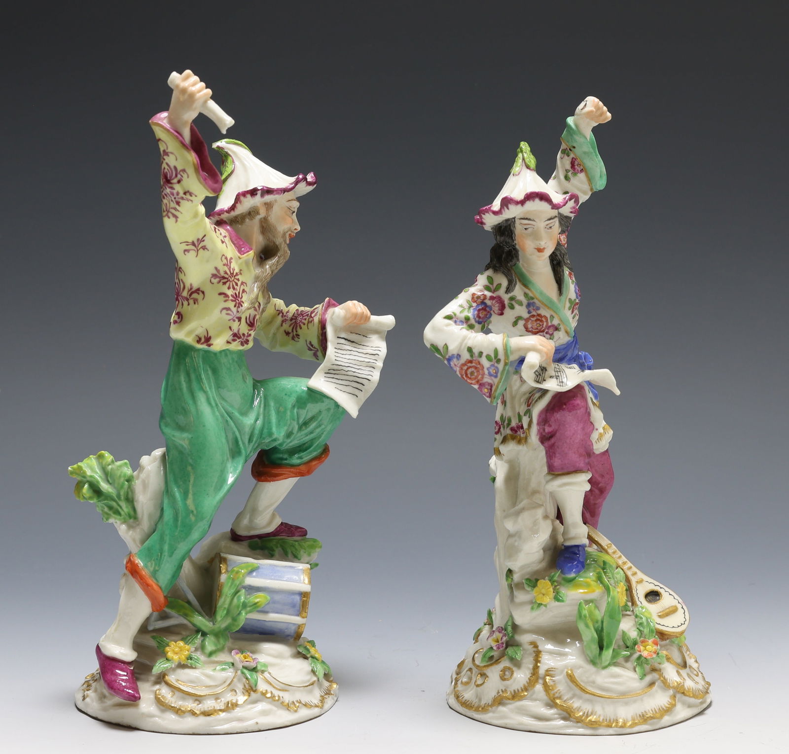 Edme Samson Porcelain Chinoisserie Musician Figures: Porcelain figures in the form of Chinese musicians, each with six-pointed star marks to the base. One figure shows loss to the item in the raised hand; the other figure shows a touched-up hairline at