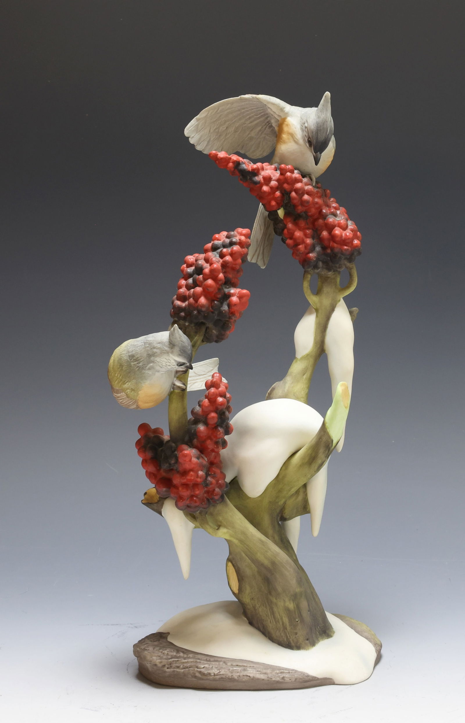 Boehm Porcelain Tufted Titmouse: Boehm birds “Tufted Titmouse - Baeolophus Bicolor, 482”, limited edition, marked on bottom. Snow draped berry tree with two perched birds. 13"h x 6"w x 4"d