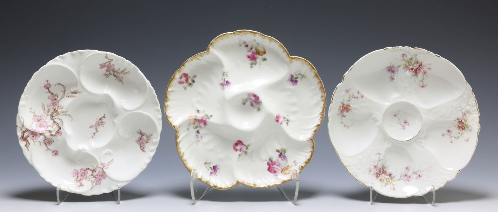 Limoges Oyster Plates: Charles Field Haviland, marked Limoges porcelain oyster serving plate, 5 wells. Haviland & Co. 4 well oyster serving plate, marked. Limoges, unmarked or covered mark, Scattered Roses pattern 5 well