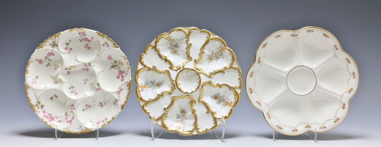 Oyster Plates: Haviland & Co. Limoges porcelain oyster serving plate for Wright, Tyndale and Van Roden, Philadelphia, 5 well, gilt and hand painted floral decoration. O. Gutherz, Limoges, porcelain oyster serving