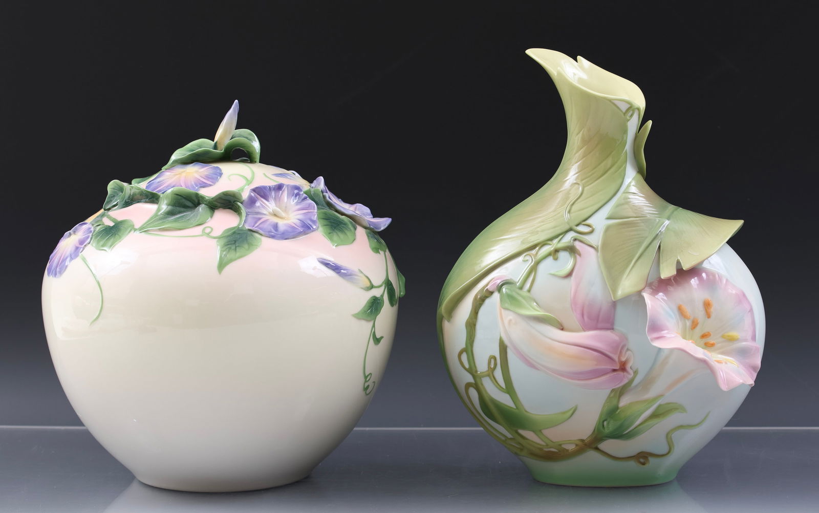 Franz "Morning Glory" Porcelain Vase and Cookie Jar: Modern China wares, including a cookie jar (8.75"h x 8"w), and a vase (10.25"h x 7.5"w x 5.5"d) with original box. (2) pieces.