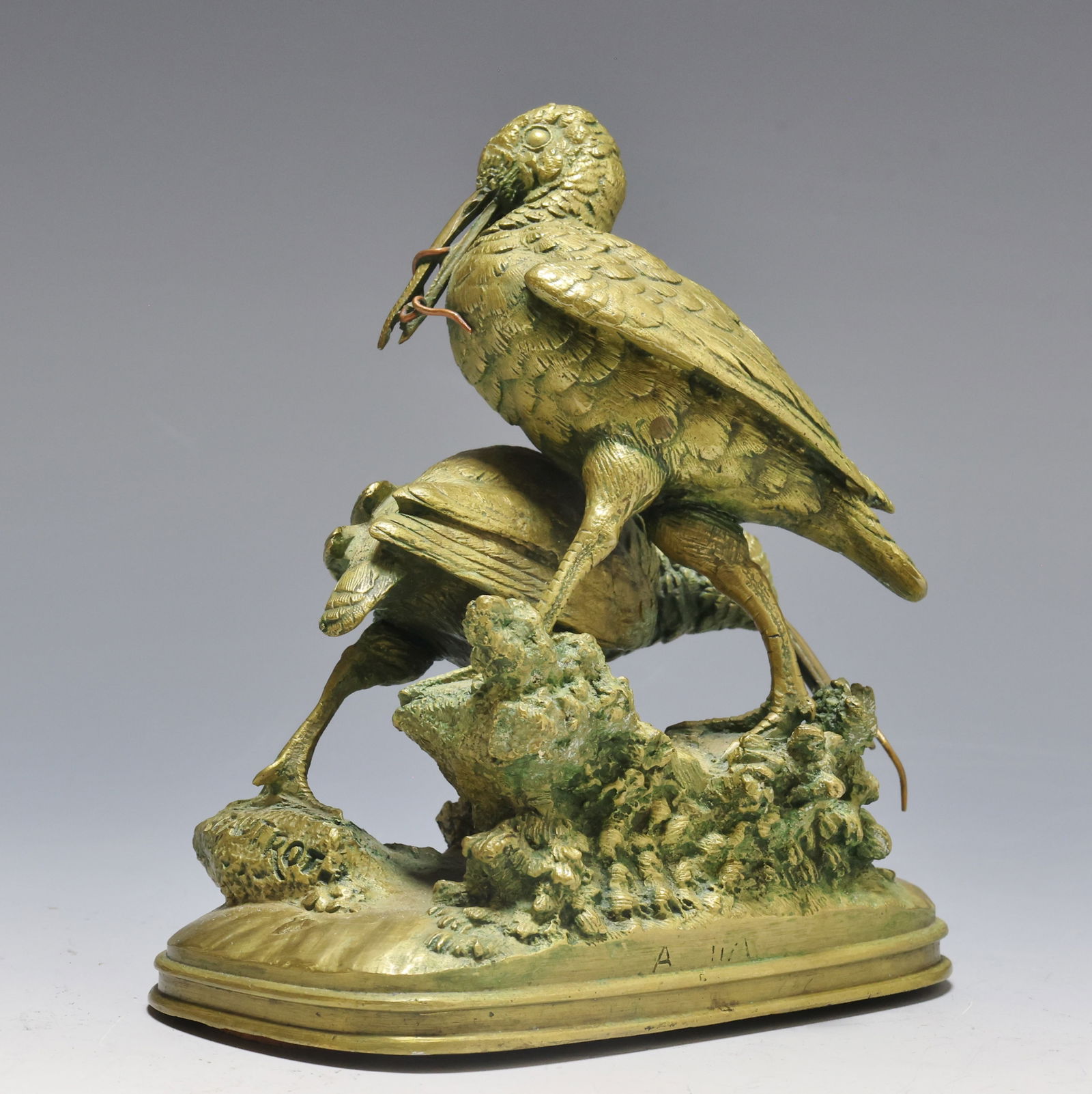 Ferdinand Pautrot (1832 - 1874): Gilt bronze naturalistic sculpture depicting young storks on a rock with worms in their beaks. Impressed signature to the base. 5"h x 5"w x 2.75"d
