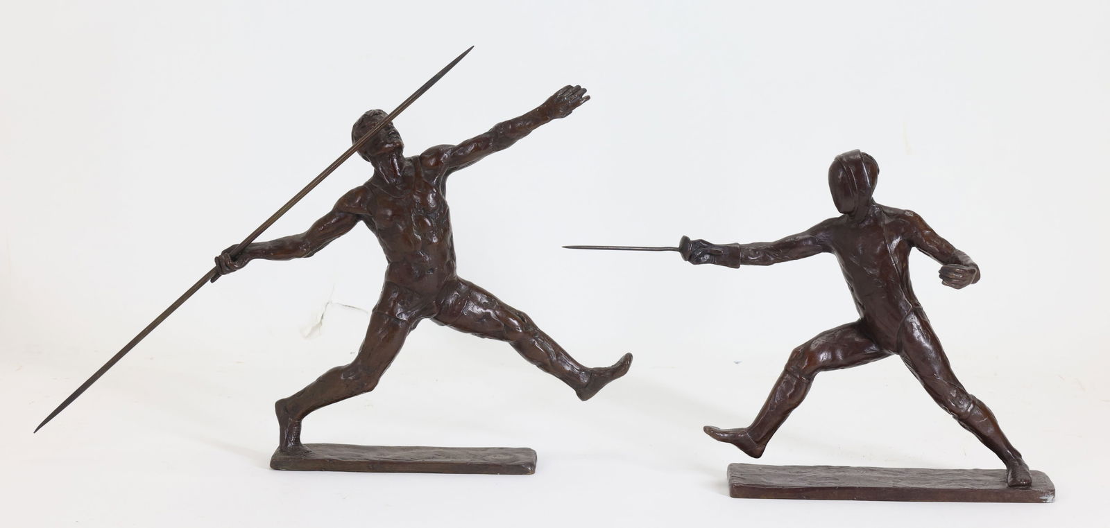 Sterett - Gittings Kelsey (B. 1941): Bronze sculptures by Sterett-Gittings Kelsey for Royal Copenhagen's Sports Series, including "Fencer" and "Javelin Thrower", each with an impressed signature at the base and dated 1976. (2)