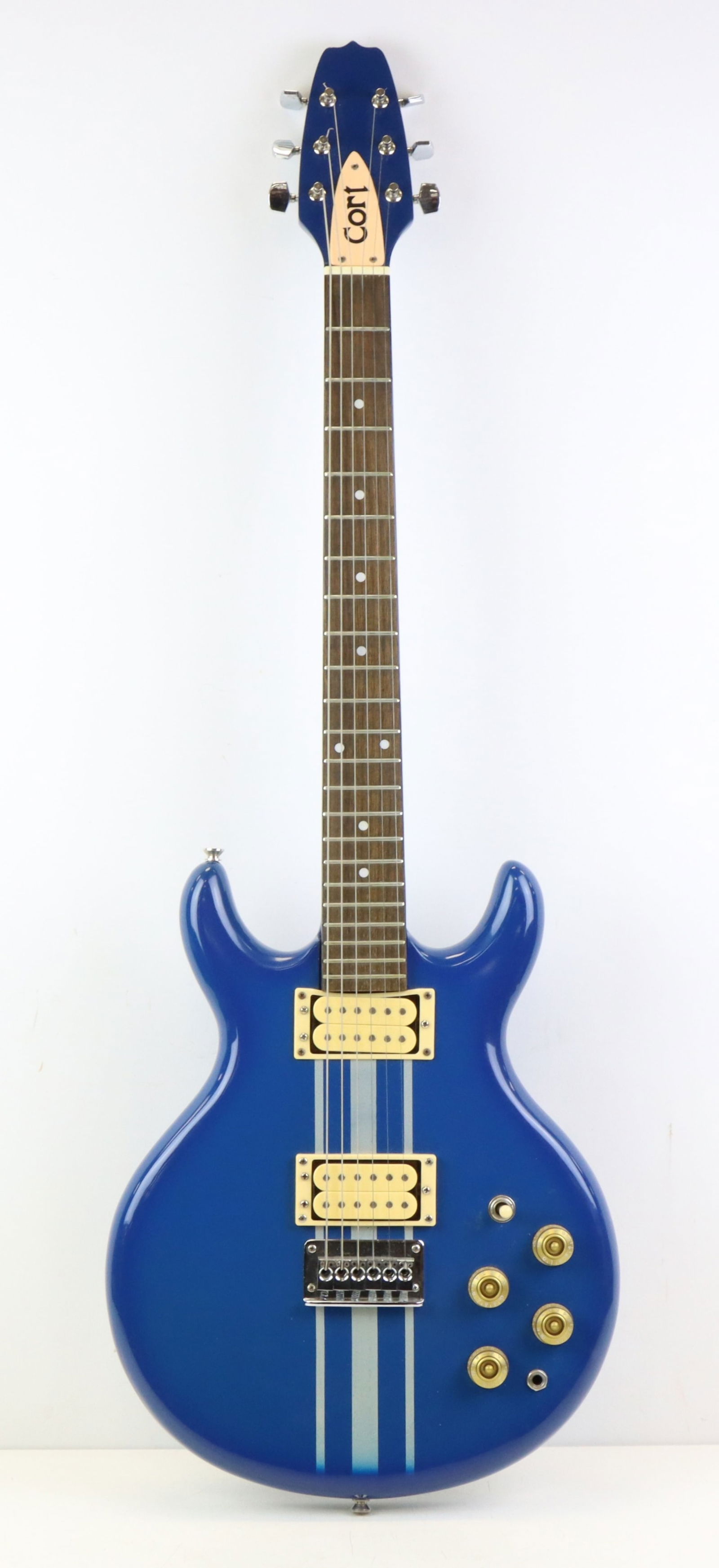 Cort Electric Guitar: Cort X-Series. Blue with silver stripes. Double cutaway. 3-position switch with 4 tone knobs. Play-tested. Case 42"h x 14"w x 4.5"d