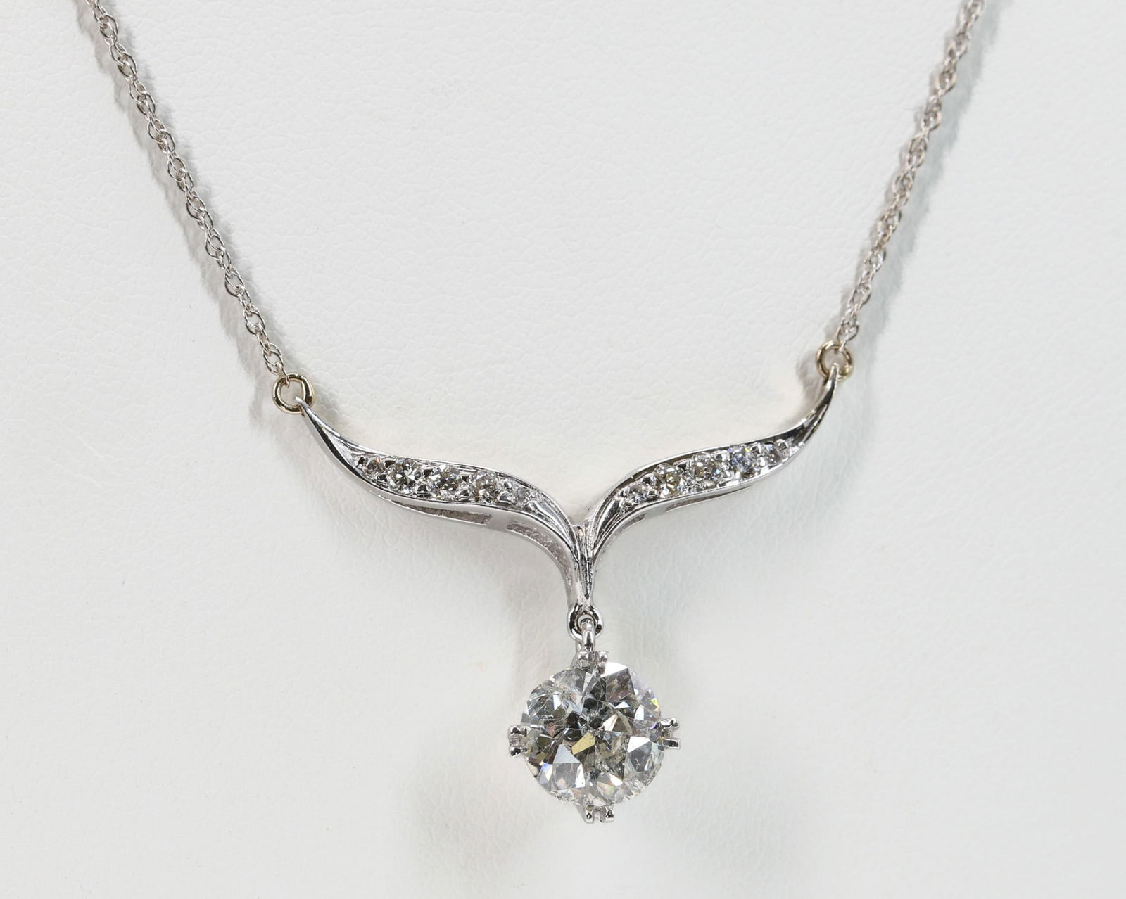 14k WG Diamond Necklace, 2.0 carats: 14k white gold pendant necklace set with approx. 2.0ct round old mine cut, I/J color, I3 clarity, with diamond accents. 16" and 2.3dwt.