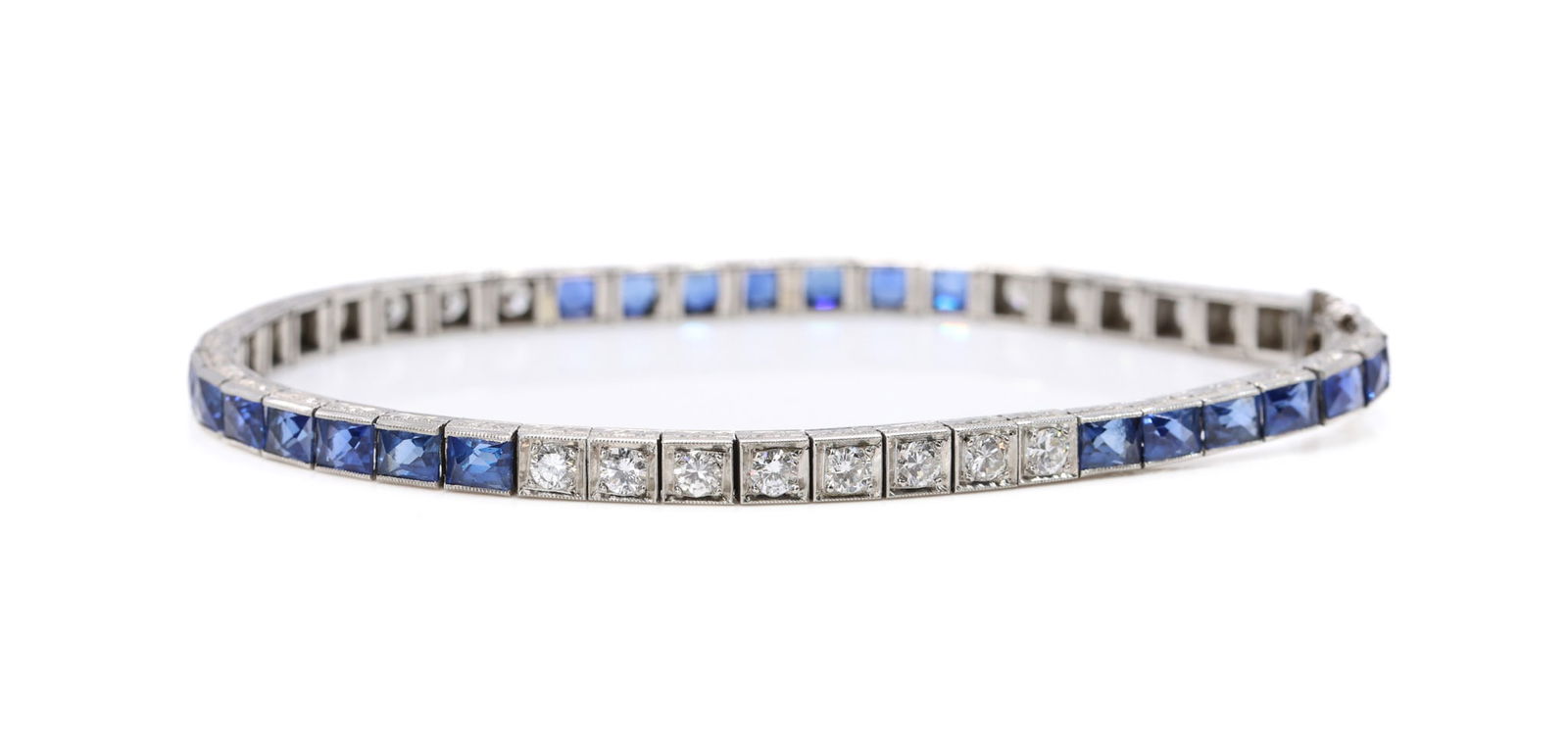Black, Starr and Frost Platinum Diamond and Sapphire Line Bracelet: Platinum Black, Starr & Frost diamond and sapphire line bracelet set with approximately 1.50 carats total weight round cut diamonds and approximately 5.00 carats total weight square cut sapphires,