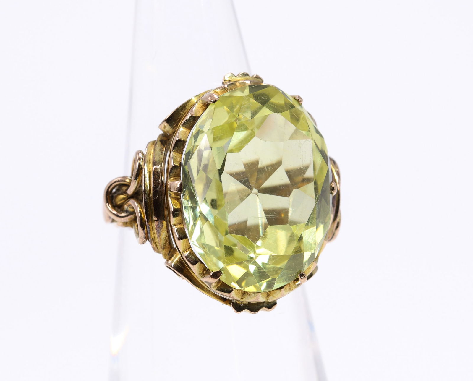 14k YG Yellow Sapphire Ring: 14k yellow gold ring set with an oval cut yellow sapphire weighing approximately 15.0 carats. Size 5.25 and 4.1dwt.