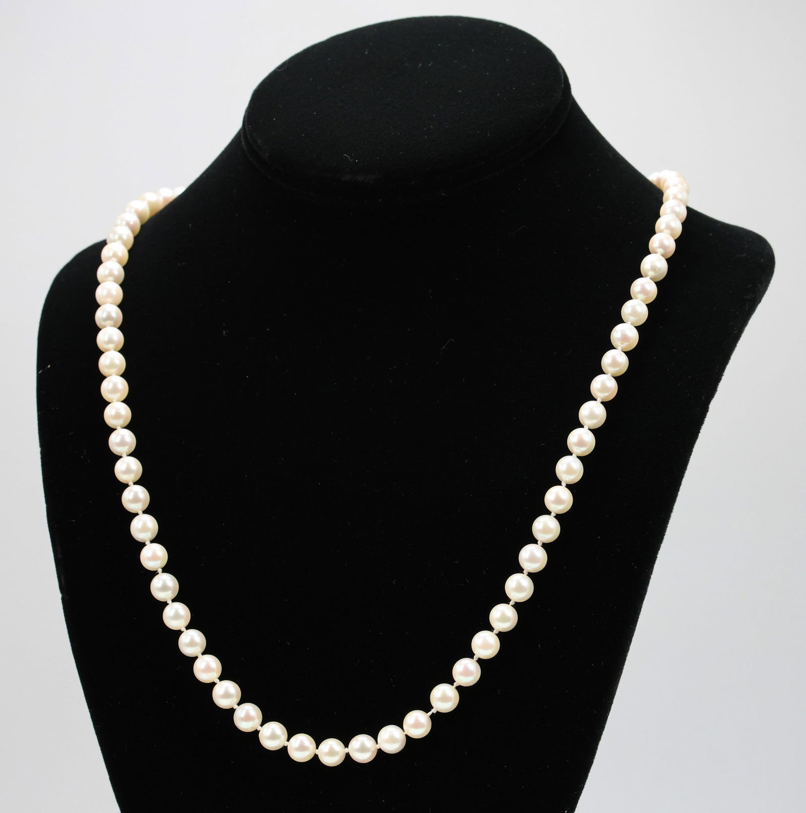 14k YG Pearl Necklace: 33" strand of cultured pearls measuring approximately 6.65–7.0 mm, completed with a 14k yellow gold clasp measuring 5/8".