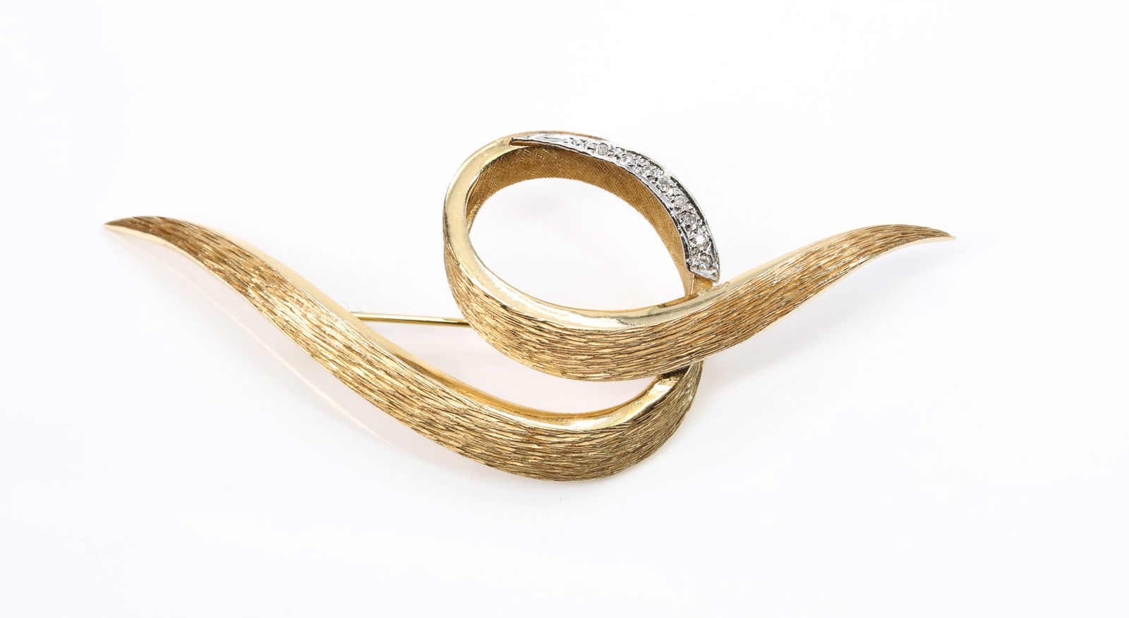 14k YG Diamond Brooch: 14k yellow gold ribbon form brooch with single cut diamond accents. 3" x 1.25". 5.6dwt.