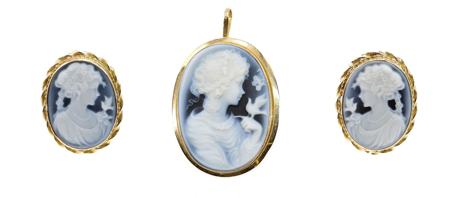 18k YG Cameo Suite: 18k yellow gold carved hardstone cameo pendant/brooch and matching cameo earrings, each depicting a classical female profile with bird, pendant 1" h., earrings .75" h., 6.9 dwt total.