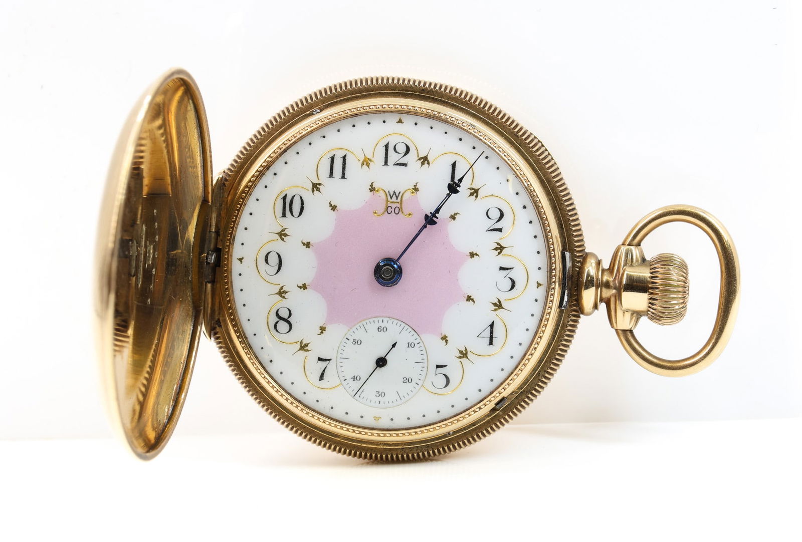14k Hampden 17j Pocket Watch: 14k yellow gold Hampden hunter case pocket watch, No. 107 D Star grade, 17 jewels, size 16s, circa 1894, white enamel dial with pink center and subsidiary seconds, blued hands, machine engraved and