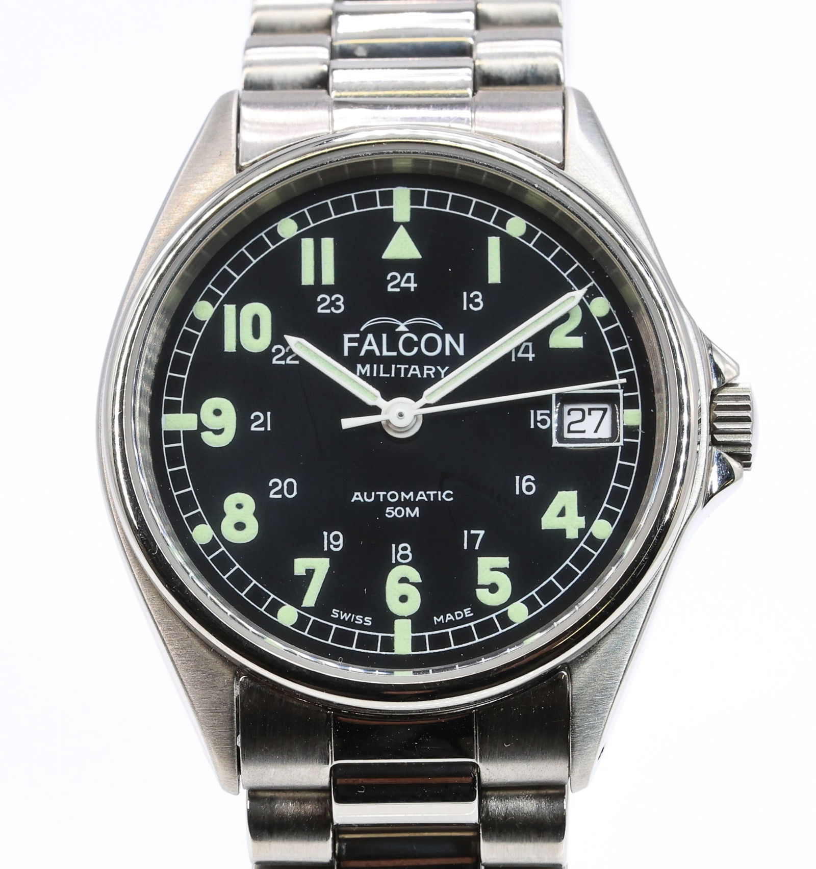 Falcon Military, Ref. 2130, Automatic Wristwatch: Stainless steel case, 34 mm, screw-back engraved 3186A and 2130, with smooth bezel and crown. Black military style dial with luminous Arabic numerals, inner 24-hour track, outer minute chapter, and