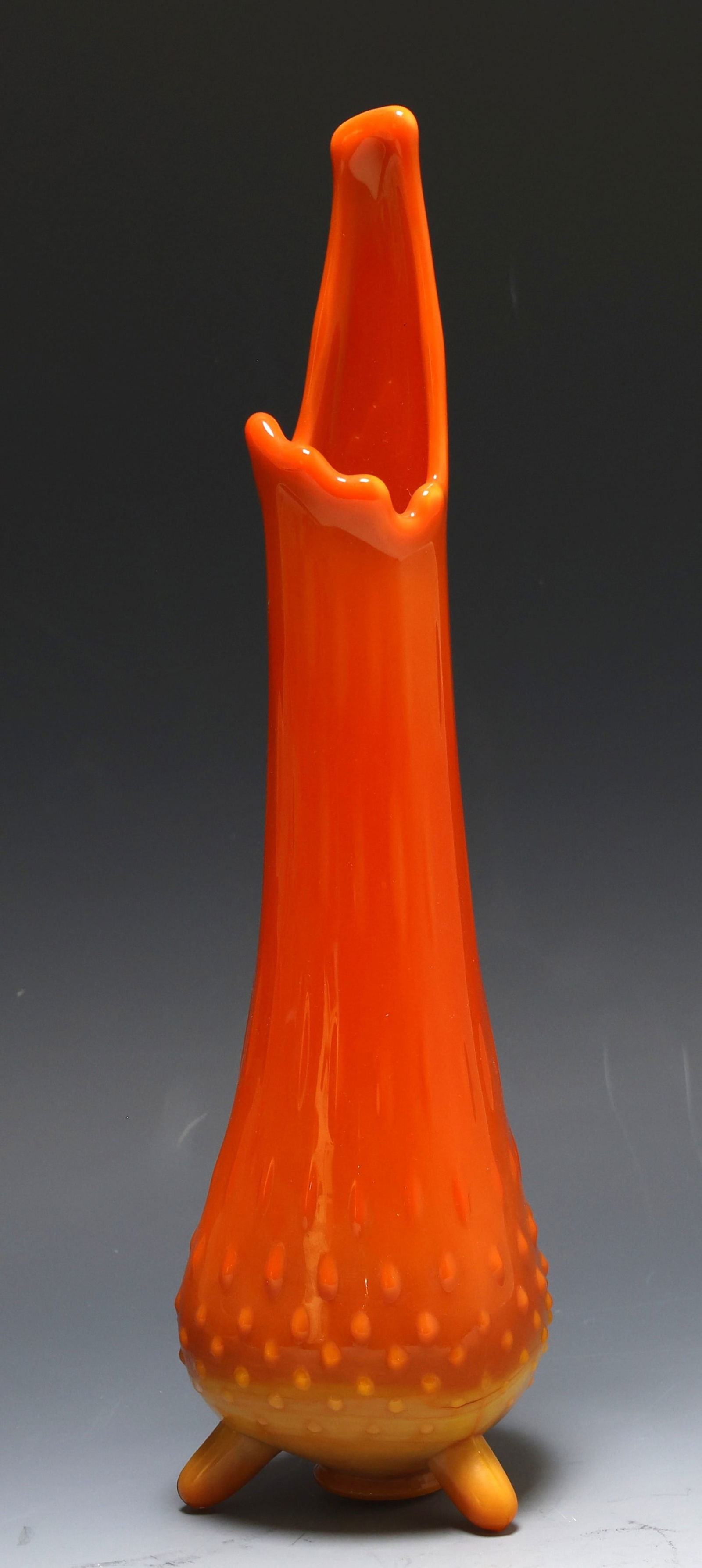 LE Smith "Bittersweet" Glass Swung Vase: Molded glass footed swung vase with a hobnail motif, orange and amber, unmarked. 12.5"h