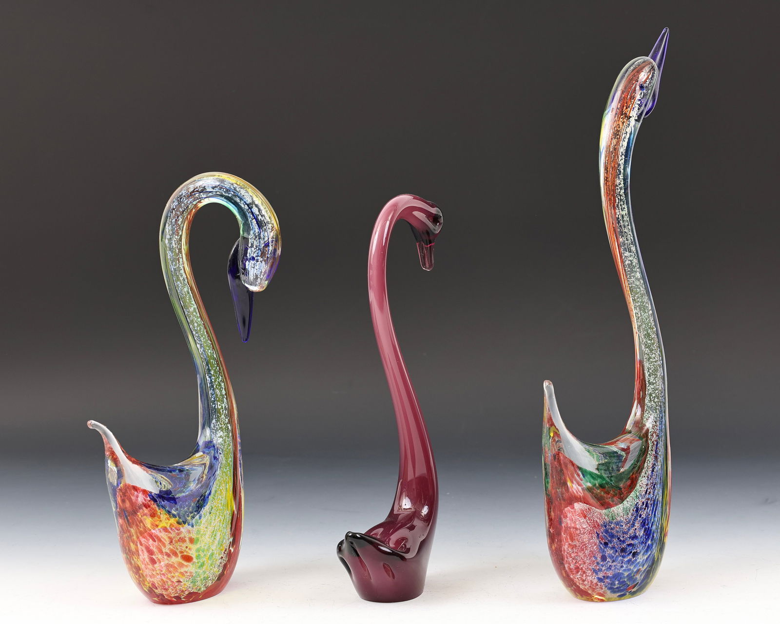 Murano Glass Swans: Italian blown glass swan figurines, including (2) featuring polychrome sommerso and silver aventurine decoration, both signed Zane, and another with amethyst and cased alabastro decoration, unsigned.