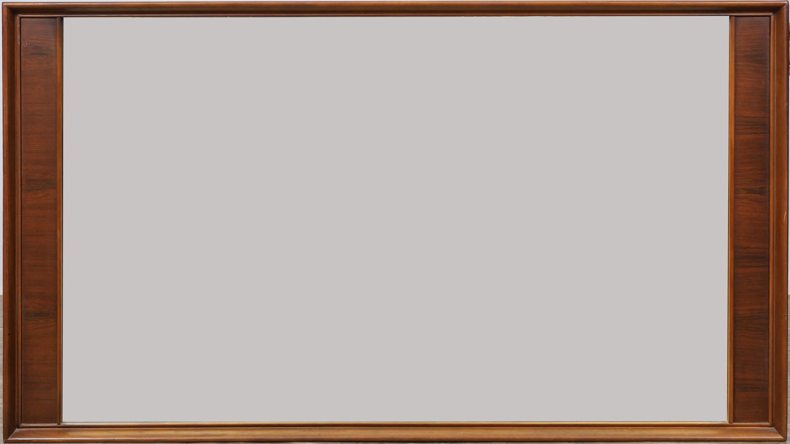 Kent Coffey "Perspecta" Mirror: Walnut and pecan having molded frame, rectangular mirror flanked by roeswood side panels. Multi-purpose mirror with both horizontal and vertical hanging fixtures. 34"h x 60"w x 2"d