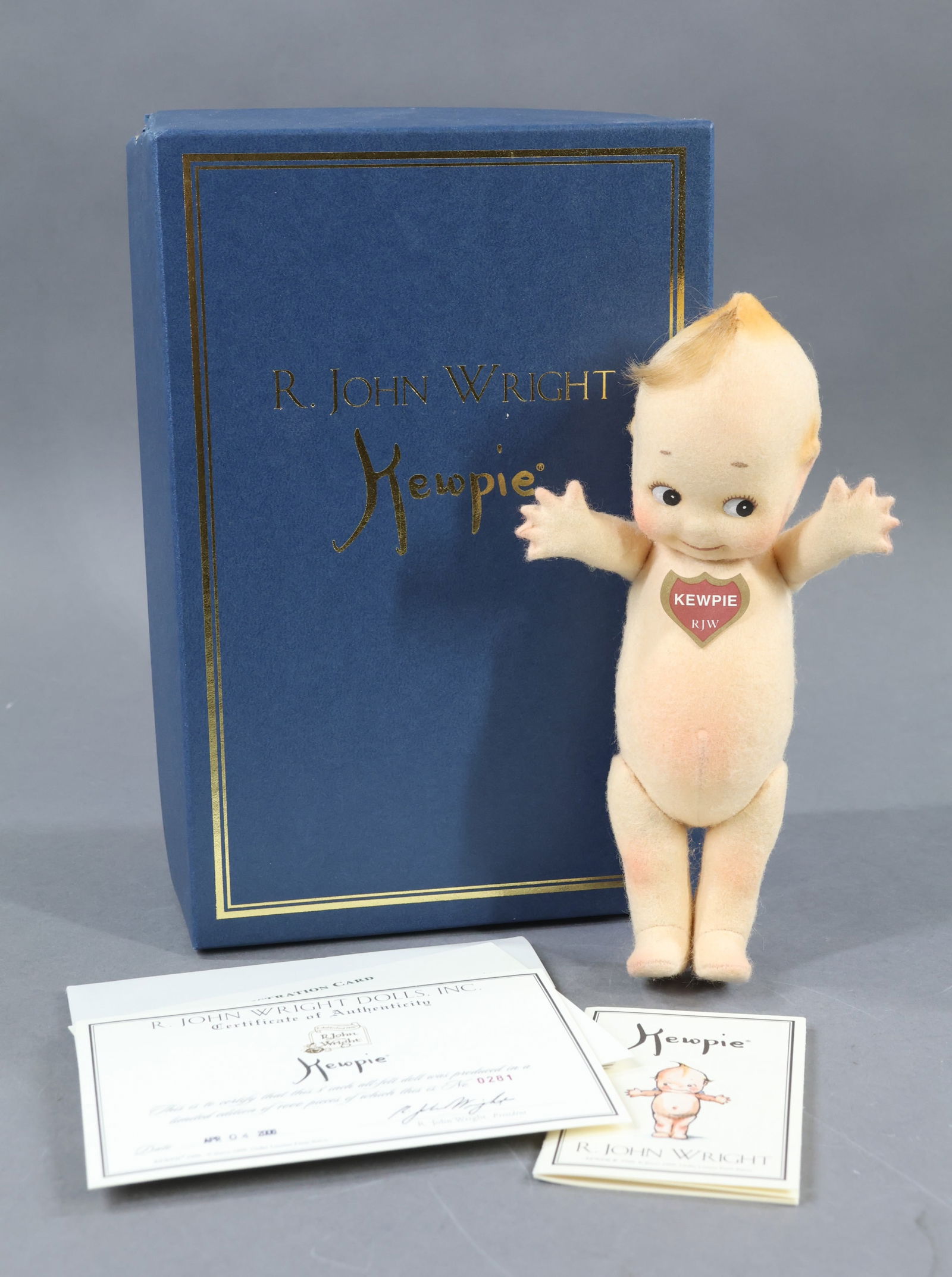 R. JOHN WRIGHT.: 8" 2000 "Kewpie", No. 0281/1000 in OB. COA. Original sleeve. Condition: Kewpie is MINT. Box has age loss. This lot is being sold AS IS.