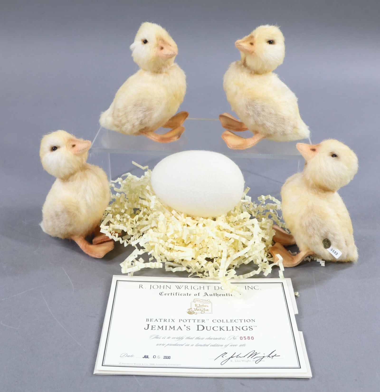 R. JOHN WRIGHT.: BEATRIX POTTER COLLECTION. 2000 "Jemima's Ducklings" in OB. 0580/1000. COA. Comes with (4) 5" Ducklings and a felt Egg. Condition: Ducklings are MINT. Box has minor age discoloration. This lot is