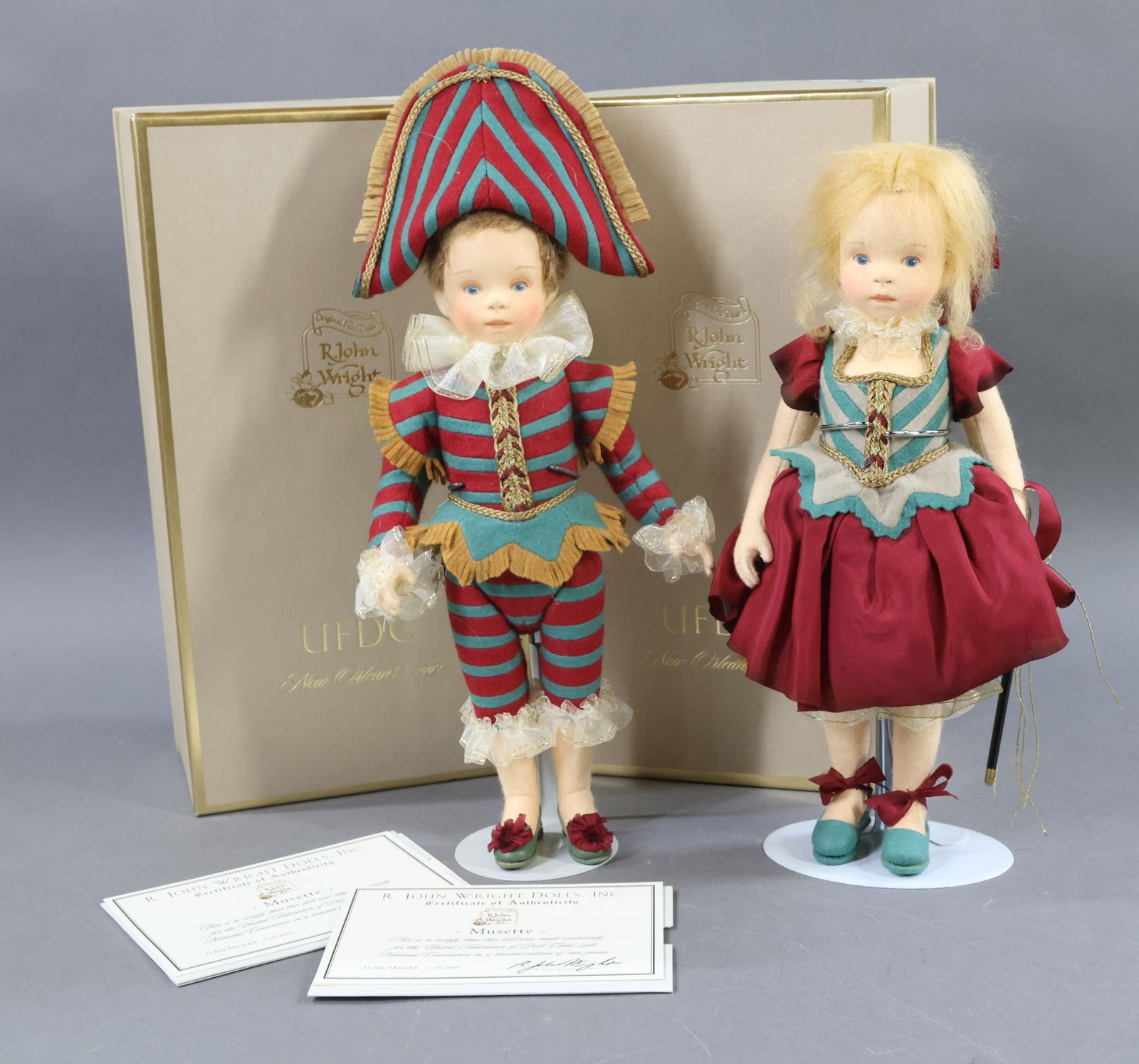R. JOHN WRIGHT.: Pair of 12" 2003 MIB 54th UFDC Convention Souvenir dolls from New Orleans "LeBal Masque". "Musette" and "Montaque" the companion doll. They both come apart and are candy containers. She was limited