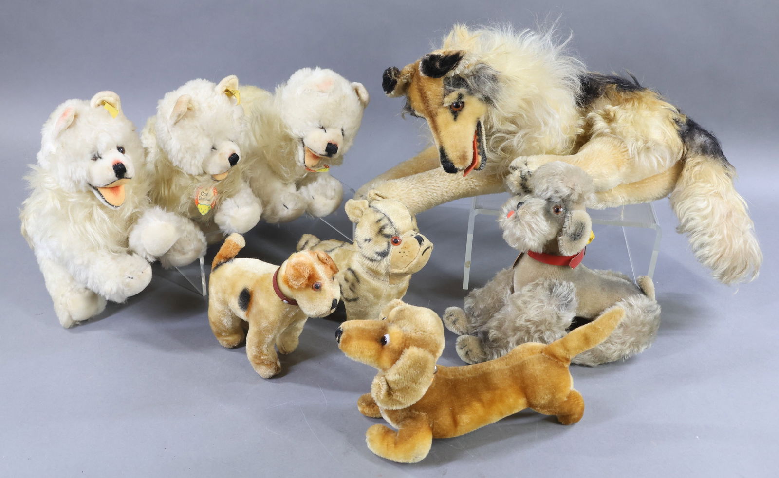 STEIFF/VINTAGE STEIFF/OTHER.: LOT of (8) Dogs. Vintage STEIFF - mohair - 16" L. 1960-1964 "Collie", lying. Long mohair mane, brown/black/white with red felt tongue. Brown glass eyes. Paper chest tag, raised silver button, yellow t