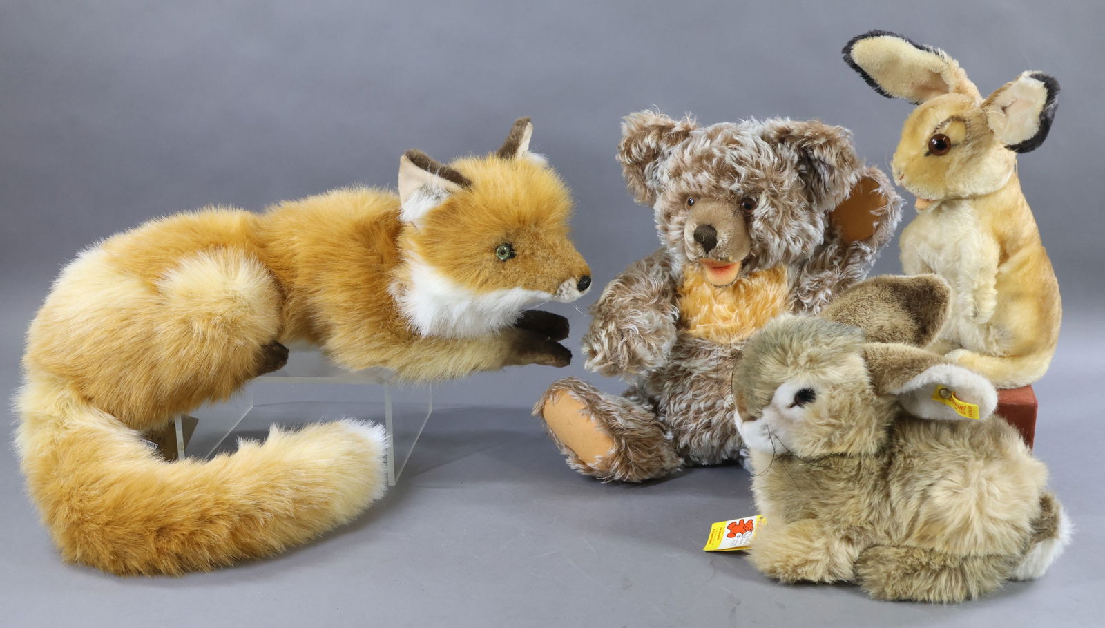 STEIFF/VINTAGE STEIFF/OTHER.: LOT of (4) animals. Vintage STEIFF - mohair - 18" Unmarked 1979-1985 "Zotty" Bear , fully jointed with swivel head. Tipped taupe mohair with yellow bib. Clipped snout. Brown glass eyes. 14" 1953-1957
