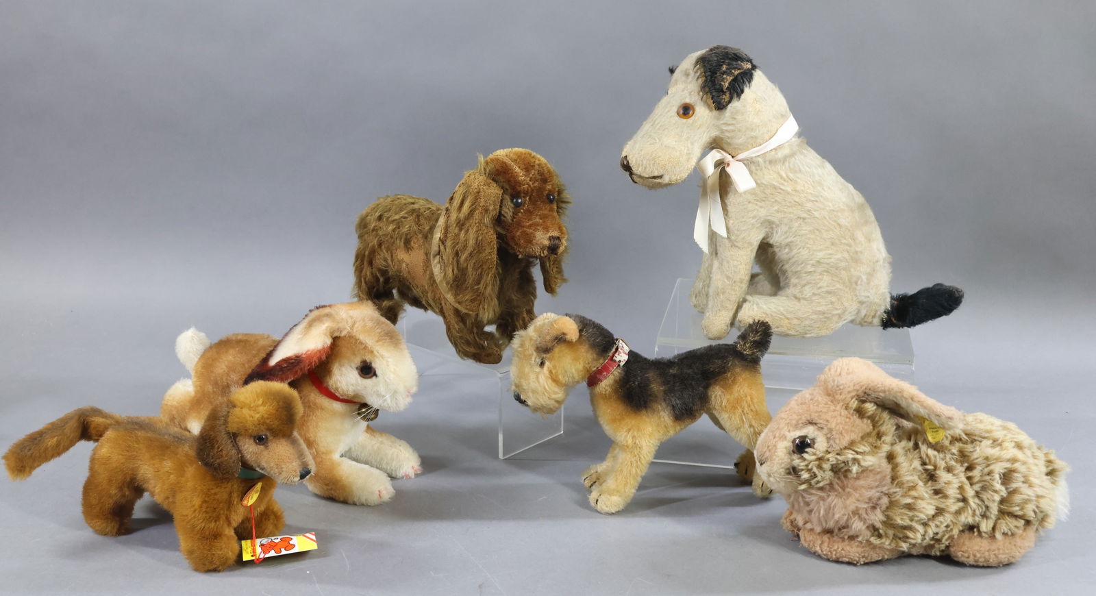 VINTAGE STEIFF/OTHER.: LOT. STEIFF - 10" L. "Hoppy" Rabbit, mohair. Incised brass button, white tag, 0135/17. 9" L. "Dormy" Rabbit, plush. Incised silver button, yellow tag, ??65/20. 8" L. Condition: age loss. Unmarked moha