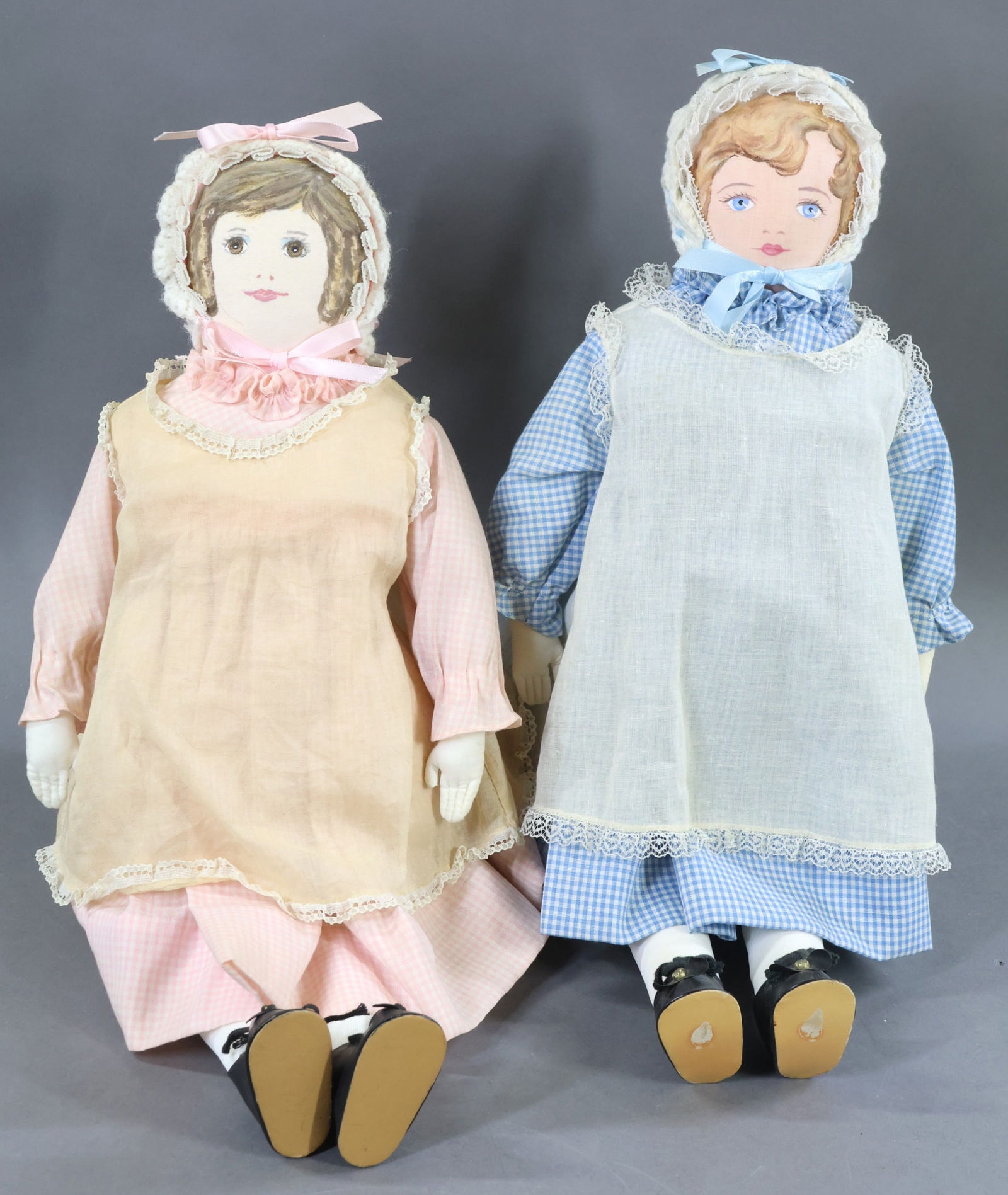 AMERICAN CLOTH DOLLS.: Pair of all original 18" "Polly Heckewelder" dolls made by the Moravian Church Ladies Sewing Society in Bethlehem, PA. Both the brunette and the blonde dolls appear to be from the 1970's as they have