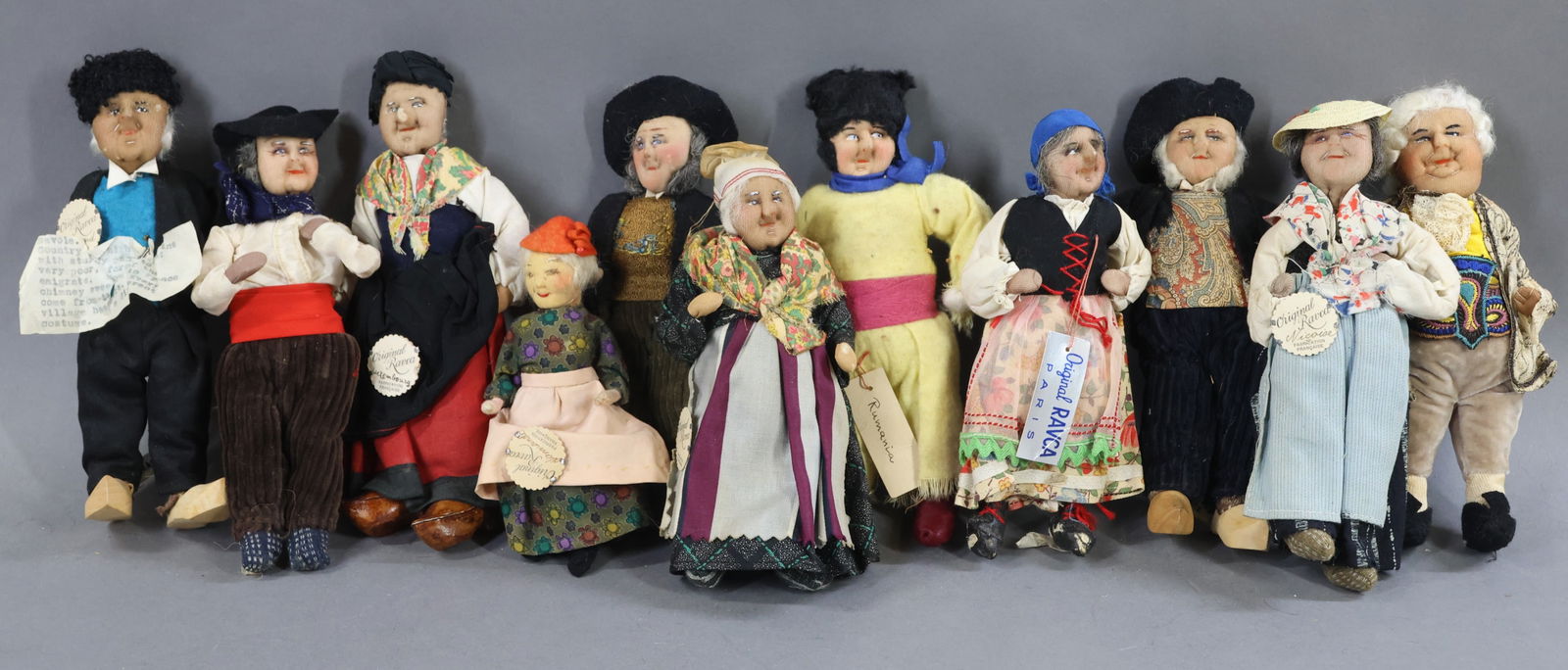 RAVCA.: LOT of (10) 8" Elderly Bernard Ravca dolls. All are marked Made in France or have the RAVCA medallions. (6) Males and (4) Females. Also- (1) 5" Female. Condition: (6) dolls are missing their clogs.