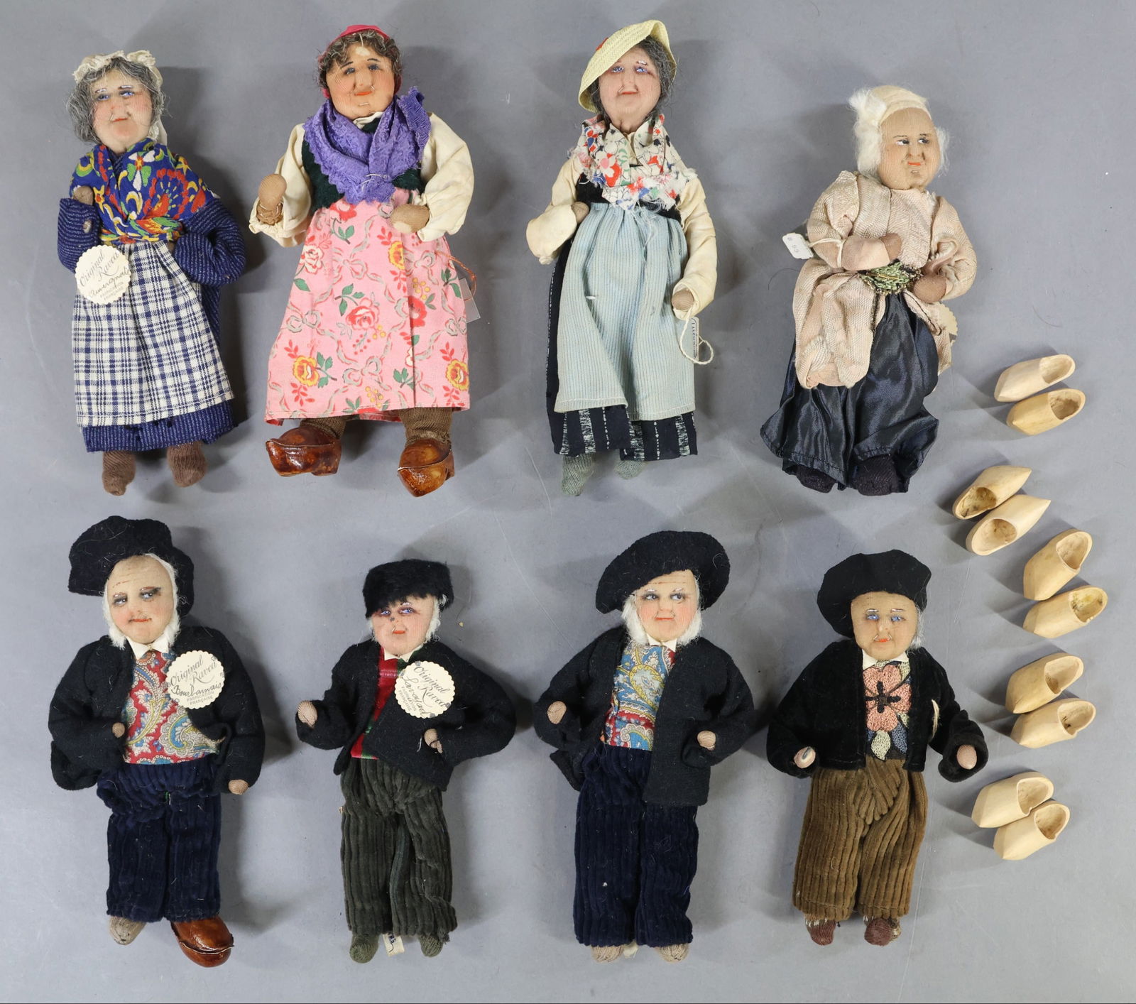 RAVCA.: Lot of (8) 7 1/2" - 8" Elderly Bernard Ravca dolls. All of them are marked Made in France or have a RAVCA tag. (4) Males that are dressed in similar outfits. (4) Females that are dressed differently.