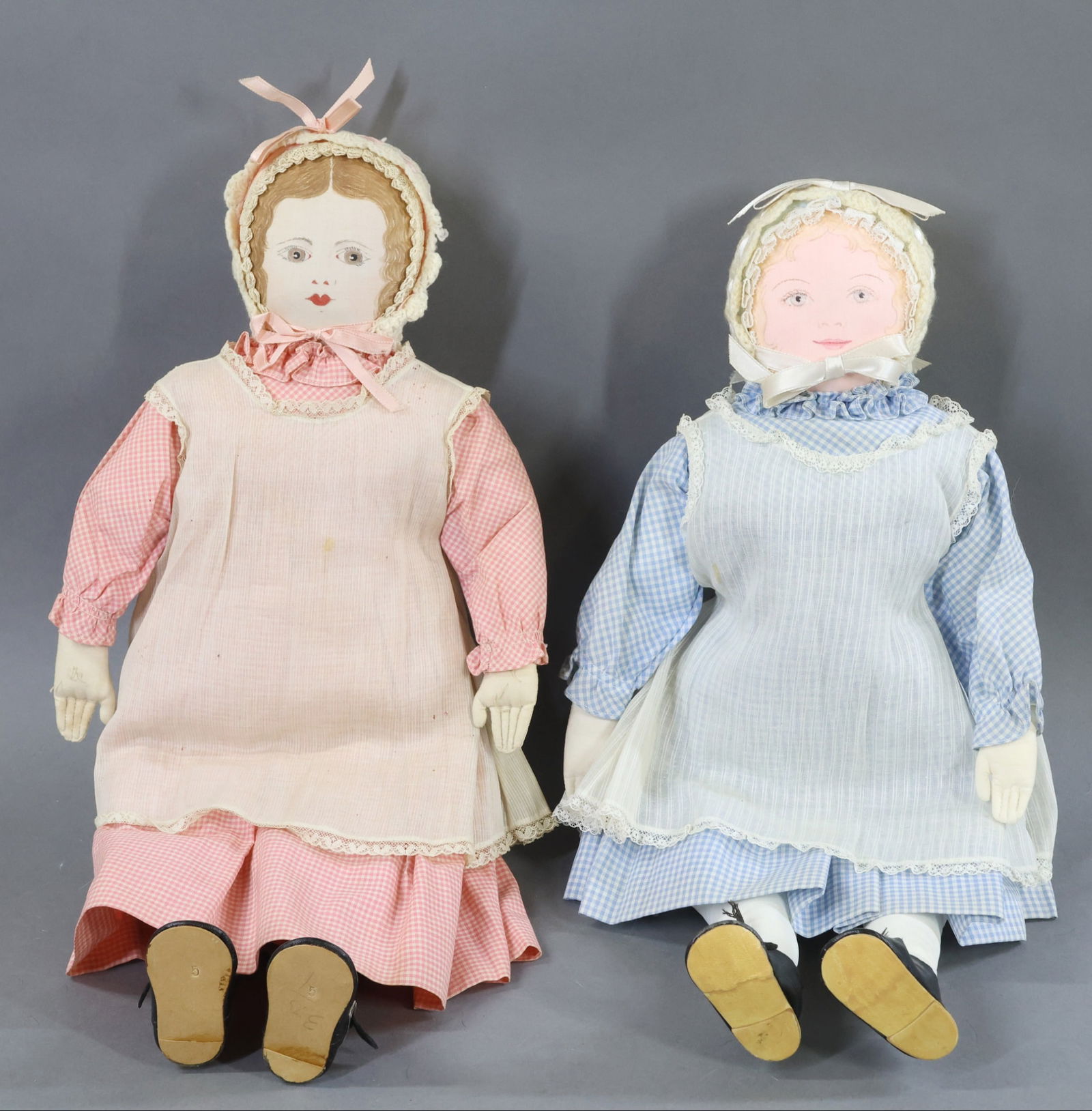 AMERICAN CLOTH DOLLS..: Pair of all original 18" "Polly Heckewelder" dolls made by the Moravian Church Ladies Sewing Society in Bethlehem, PA. The brunette appears to be from the 1960's because of the face painting. The