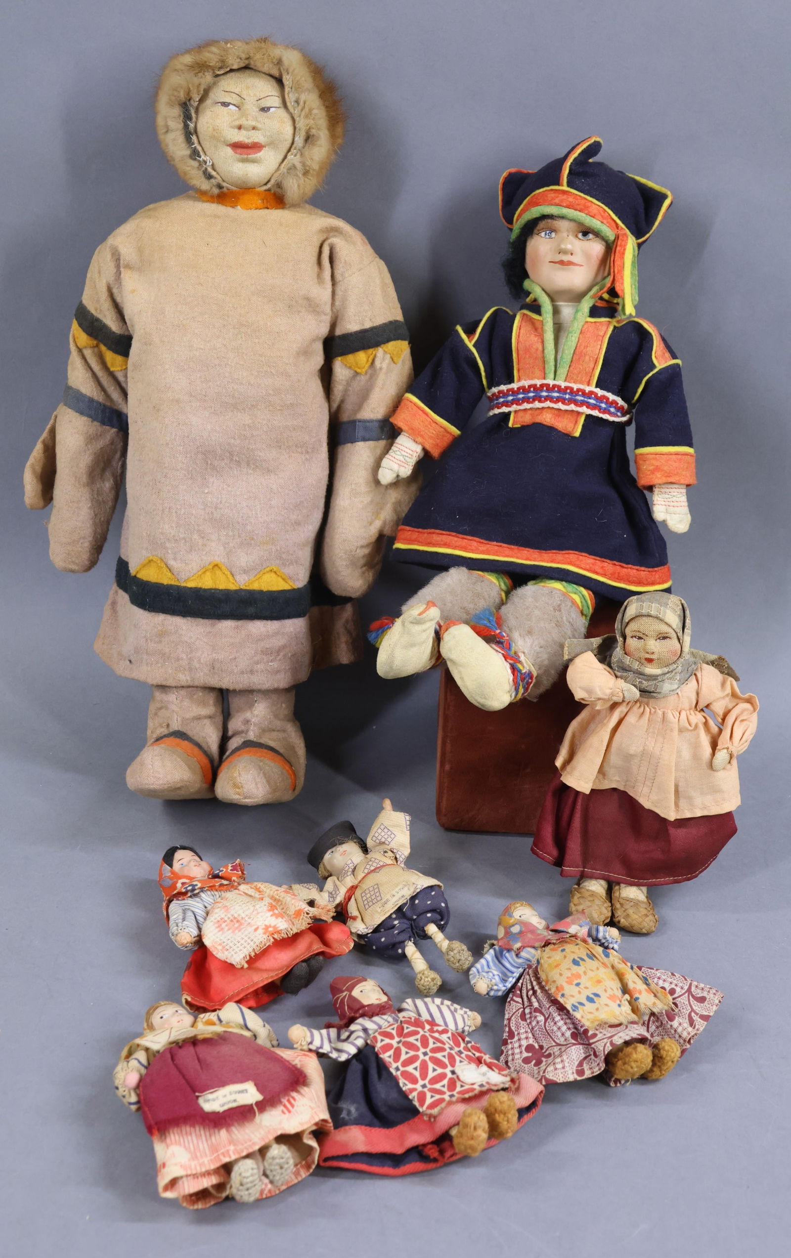 DOLLS REPRESENTING FOREIGN COUNTRIES.: LOT of (7) all original dolls from the Soviet Union and (1) from Finland. Soviet Union - (2) Are tagged Made in Soviet Union. 4 1/2", 6 1/4", 14". They either have composite heads or cloth mask faces