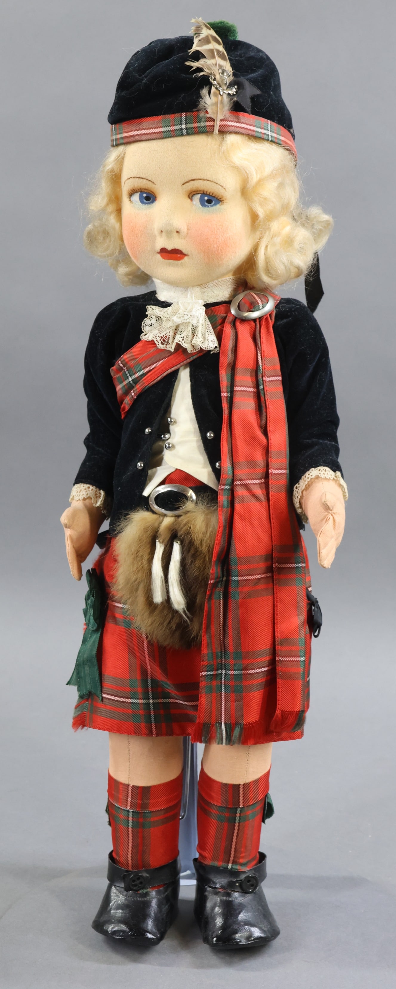 CLOTH DOLLS.: 18 1/2" All original ALPHA TOYS, England, "Scottish Lass" Doll. Felt face with painted features, blue side glance eyes. Blonde mohair wig. Cloth body. Marked on left foot under shoes. Traditional plai