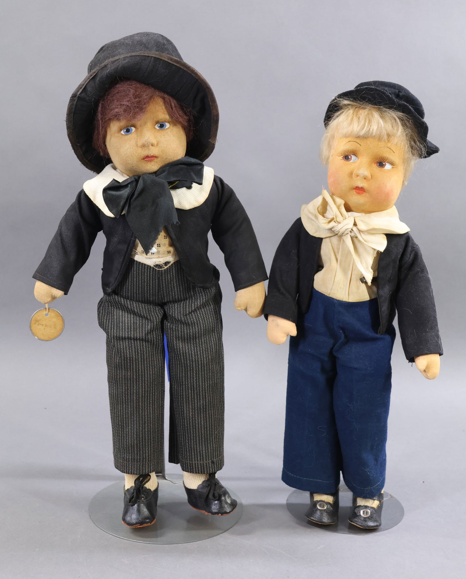 AMERICAN CLOTH DOLLS.: Pair of 1933-1940 MADAME ALEXANDER male character dolls. Both dolls have mask faces with painted features, mohair wigs and except for (1) hat, clothing appears to be original. 15" Tagged "David