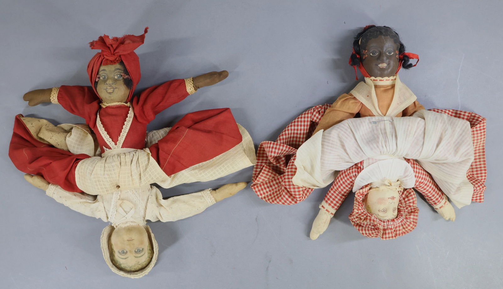 AMERICAN CLOTH DOLLS.: Pair of 12" all original BRUCKNER Topsy-Turvy dolls. (1) Set is tagged. Both of the Black dolls have some mohair while the other side has painted hair. Condition: age discoloration, some loss. This lo