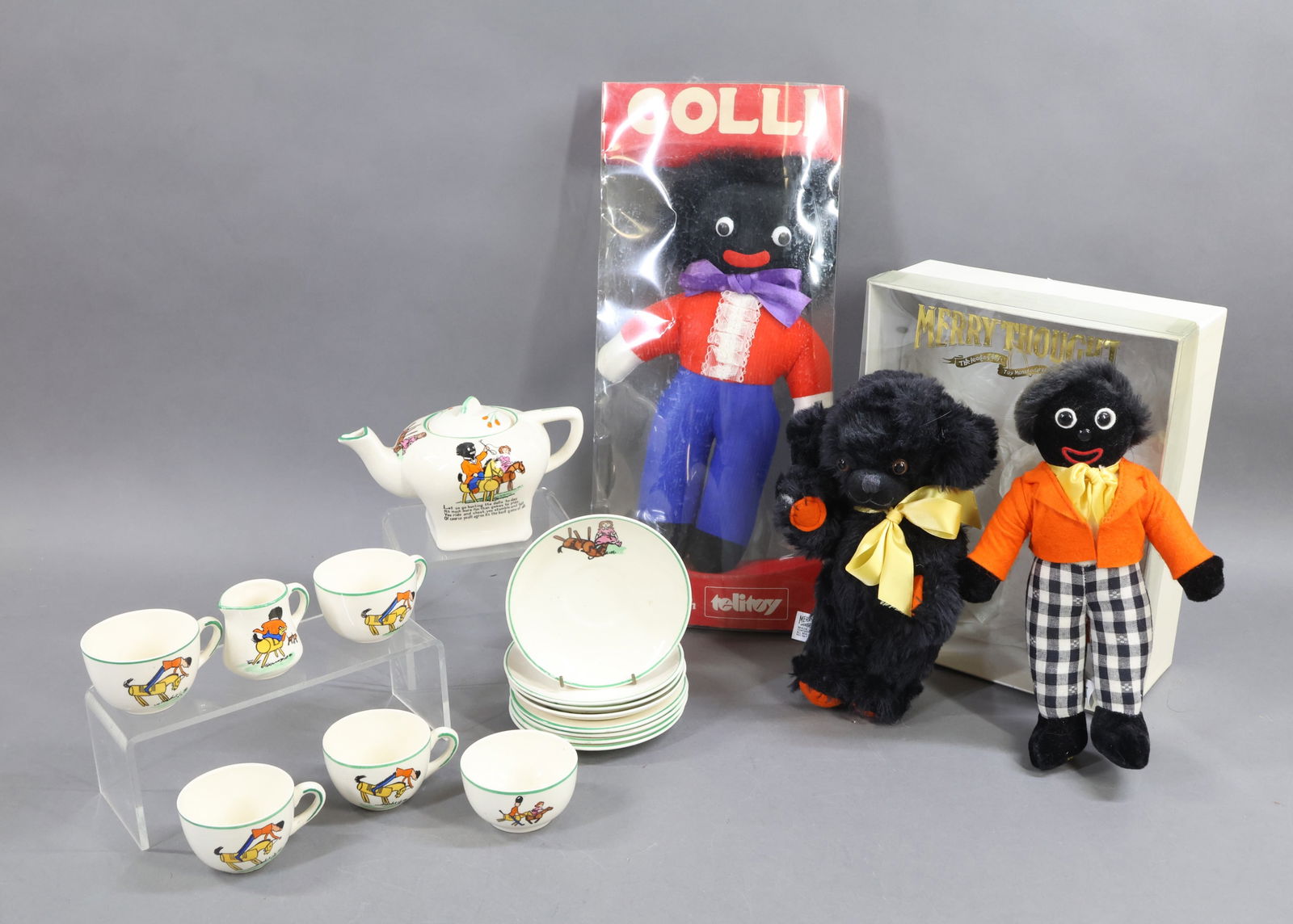 BLACK DOLLS/CHINA.: LOT of GOLLIWOG items. 11" Cloth "GOLLI" Playtime with Telitoy, Leicester, England. Original container. (Damage to container.) MERRYTHOUGHT "Cheeky & Golly Set" in original box. 9" Black mohair