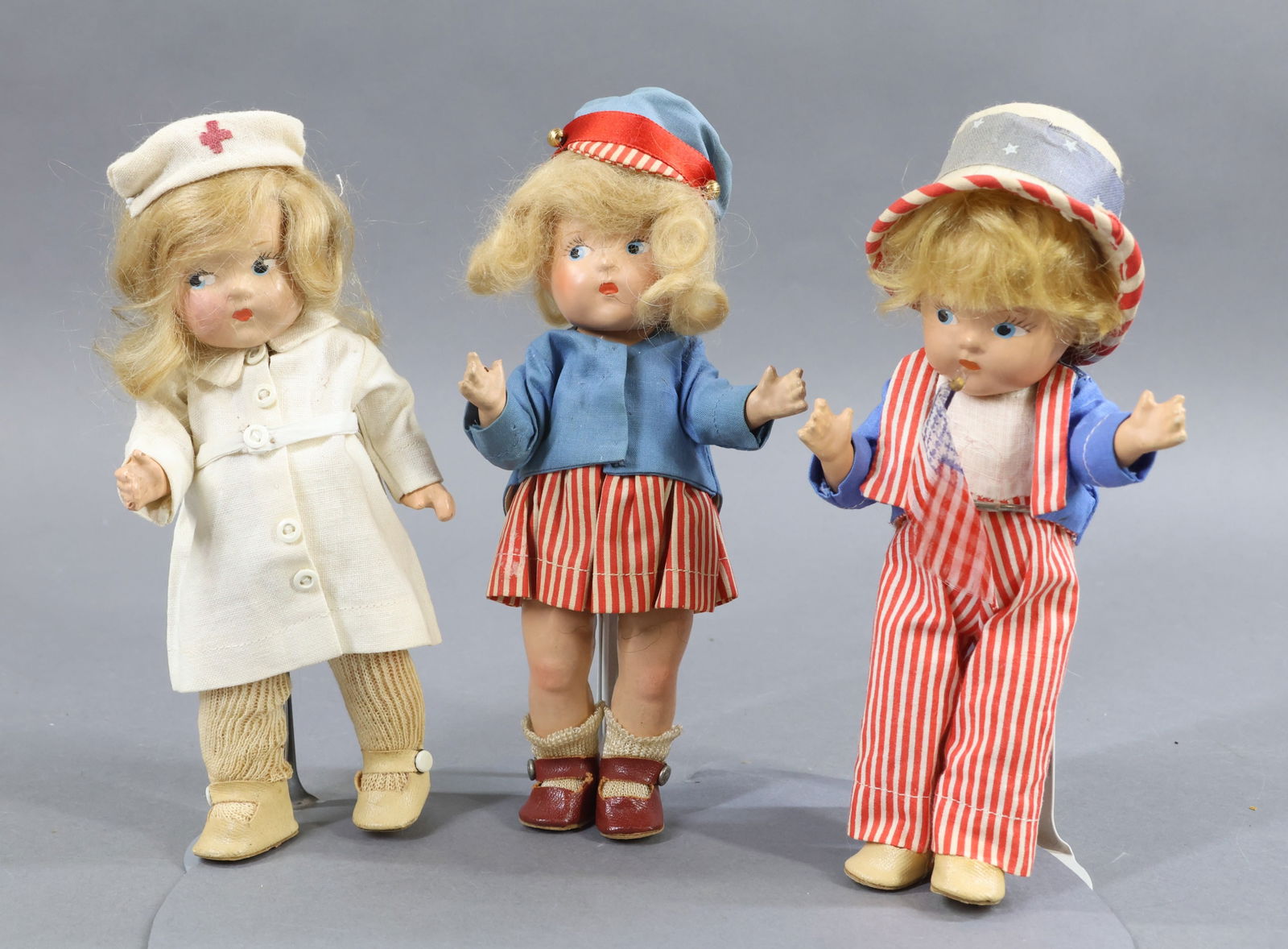 DOLLS IN UNIFORMS.: LOT of NURSE, PATRIOTIC Dolls. These are all 8" 1937-1948 composition VOGUE Ginny "Toddles" dolls. They have painted side glance eyes, blonde mohair wigs. They are all dressed in original clothing and