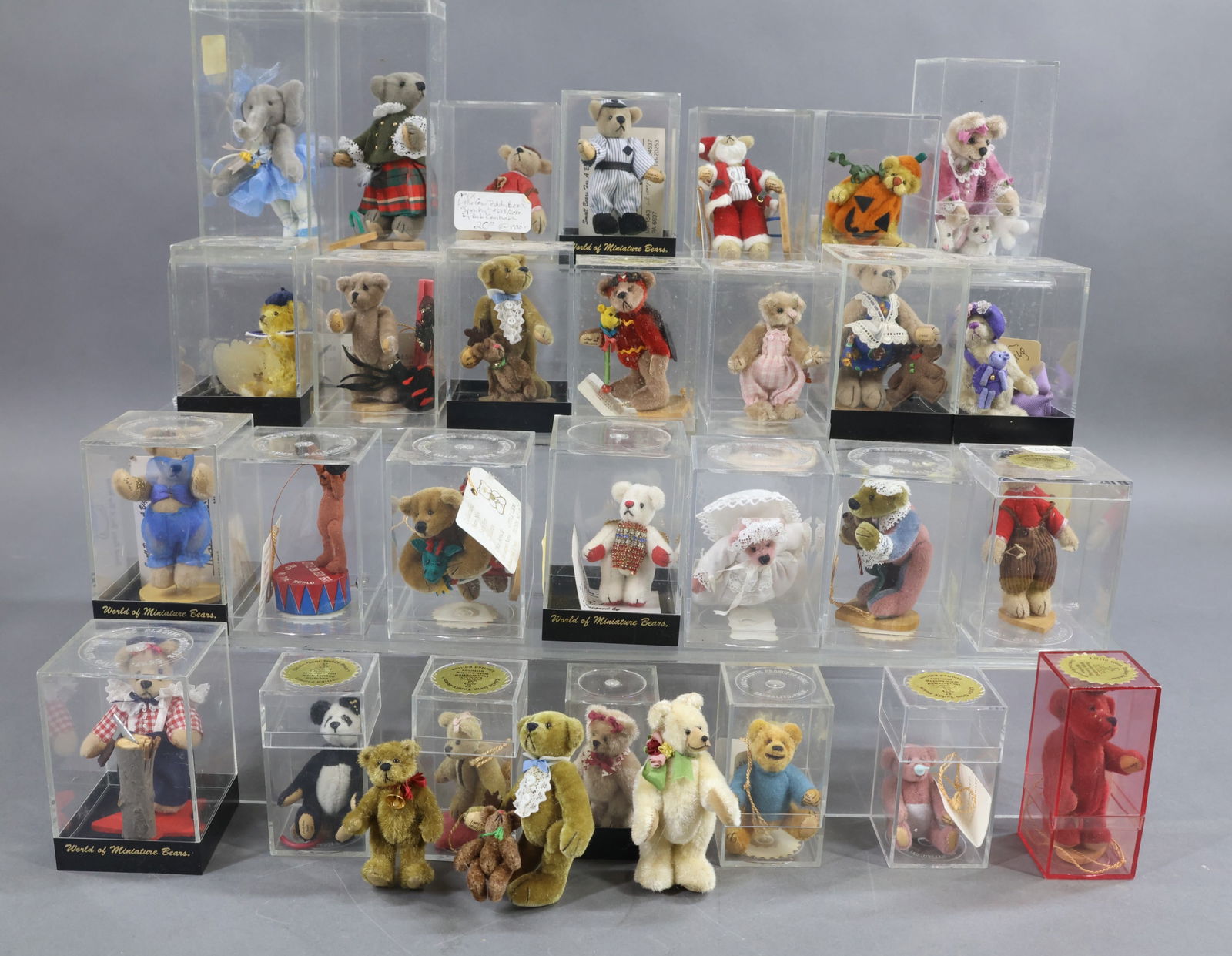 MINIATURES.: LOT of (31) plush Bears/animals by World of Miniature Bears and Little Gem Teddy Bears. All but (3) are in their original plastic containers. They are all Bears except (1) is a dancing Elephant Baller
