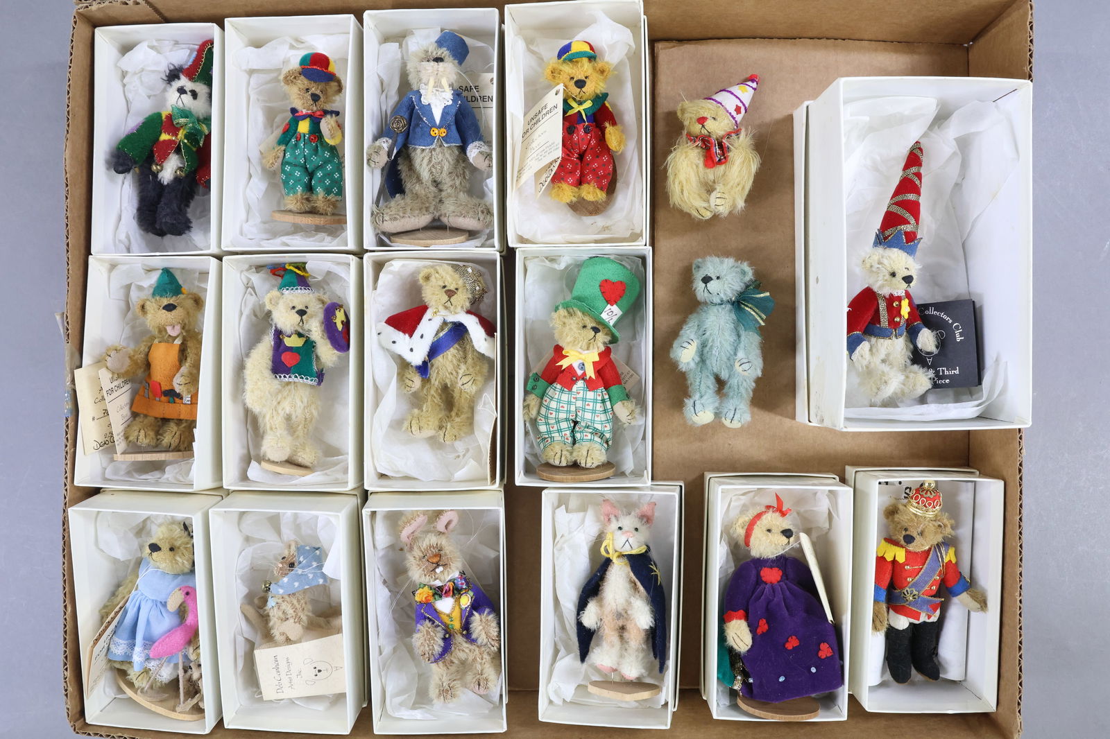 MINIATURES.: LOT of (17) mohair animals by Deb Canham. All but (2) are in their OB. (1) Walrus, (1) Cat, (1) Mouse, (1) Rabbit and (13) Bears. 2 1/2" - 4". Condition: this lot is being sold AS IS.