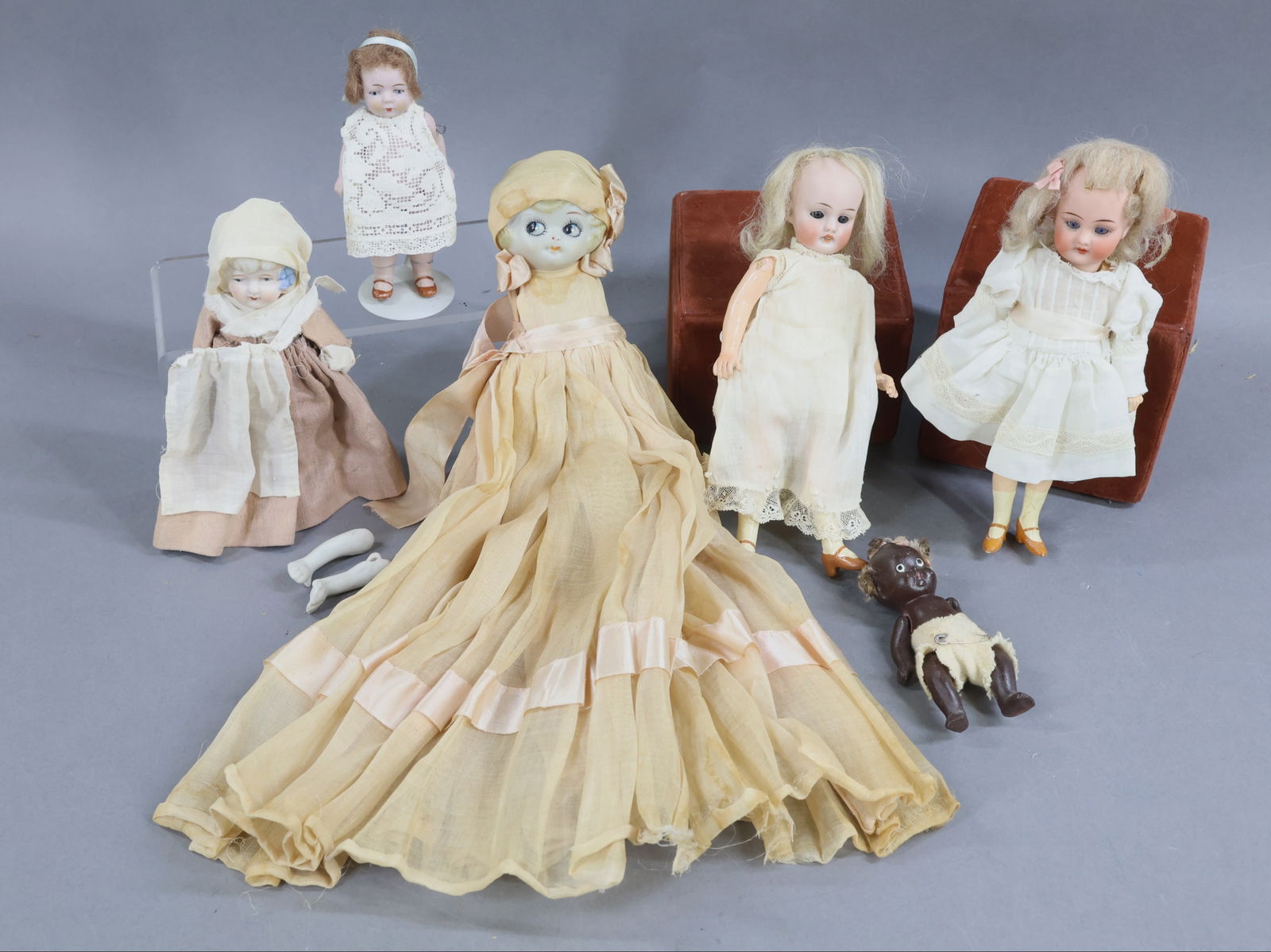 BISQUE DOLLS, 12" UNDER.: LOT of antique dolls. Pair of 7" German dolls with 5 pc. papier mache flapper style bodies, painted shoes. Both have sleep eyes, open mouths, blonde mohair wigs. They are dressed in vintage white clot