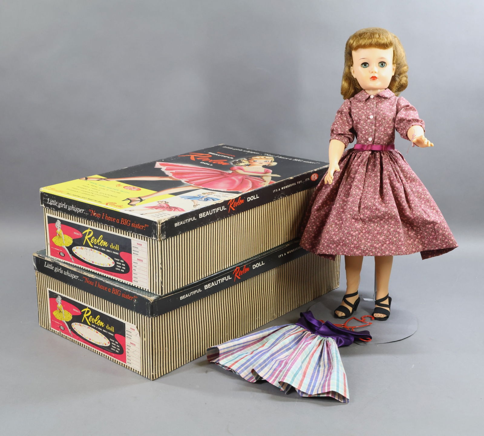 1940's-1960's DOLLS.: LOT of (3) 1955-1959 IDEAL "Revlon" dolls. All of the dolls have honey blonde rooted hair. 18" Doll in an OB . Box end reads: #7750, Blonde, Pink. There is also a white fur stole and bag of jewelry