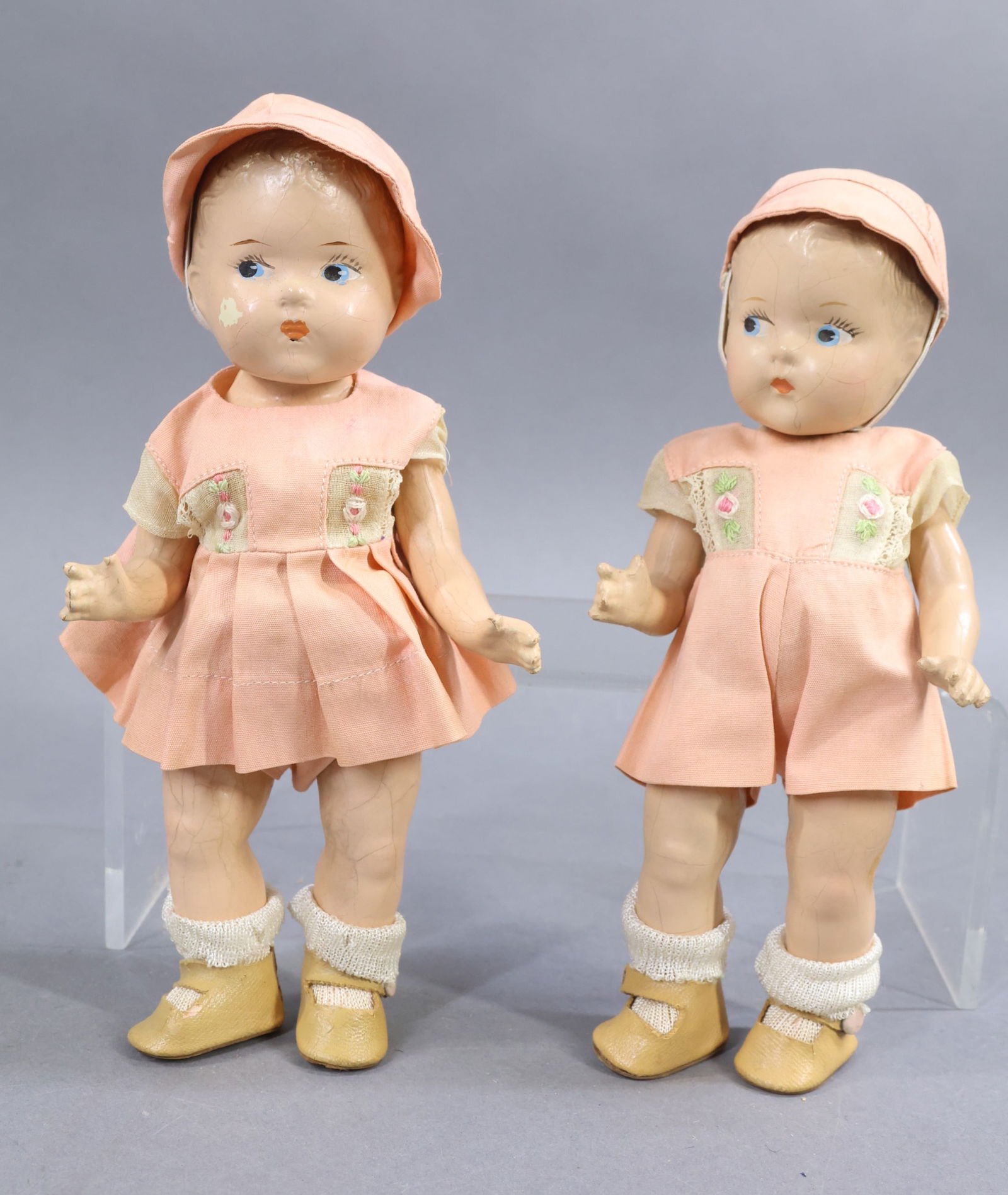 1940's-1960's DOLLS.: LOT. Pair of 8" VOGUE composition 1937-1948 "Toddles" dolls with painted blue side glance eyes, painted light brown hair. Bodies are marked" DOLL CO. on backs. Shoes are stamped TODDLES on soles. Boy