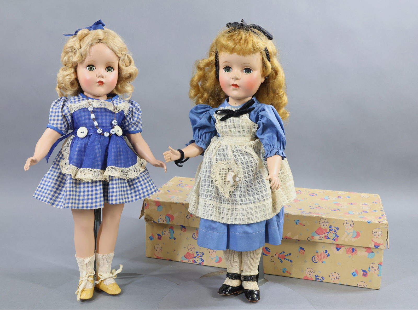 1940's-1960's DOLLS.: Pair of 14" all HP original dolls. Both dolls have blue sleep eyes. R & B 1954 "Nanette" doll in OB. Blonde uncombed mohair wig. Nice face coloring. She is wearing the "Nanette" necklace. Ivory