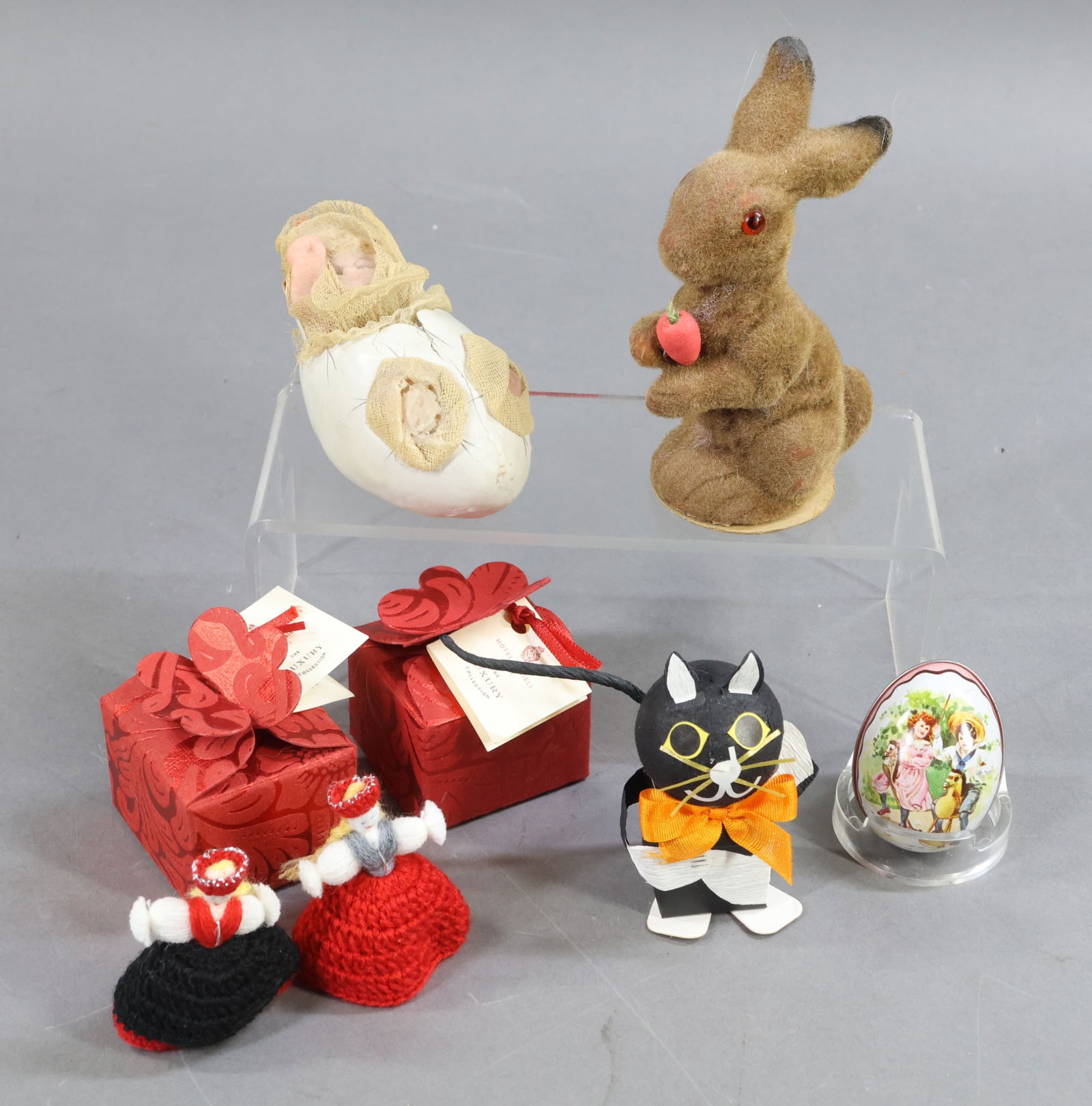 HOLIDAY/NOVELTIES.: NOVELTY. Lot of (6) Candy Containers. Antique - 4" c. 1890 French Egg container with poured wax baby head, tiny painted blue eyes, pink closed mouth. Curly blonde mohair locks peek out from under the