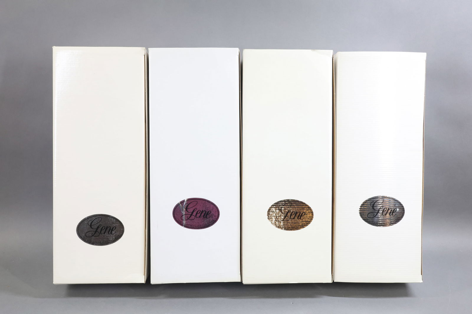 CONTEMPORARY ARTIST DOLLS.: LOT of Mel Odom's GENE. (4) MINT dolls in OB. (3) Dolls NRFB. NOTE: boxes have been written on and dated by original owner. Undated "Tea at The Plaza". COA. #3550. FAO Schwarz Exclusive. Stand reads: